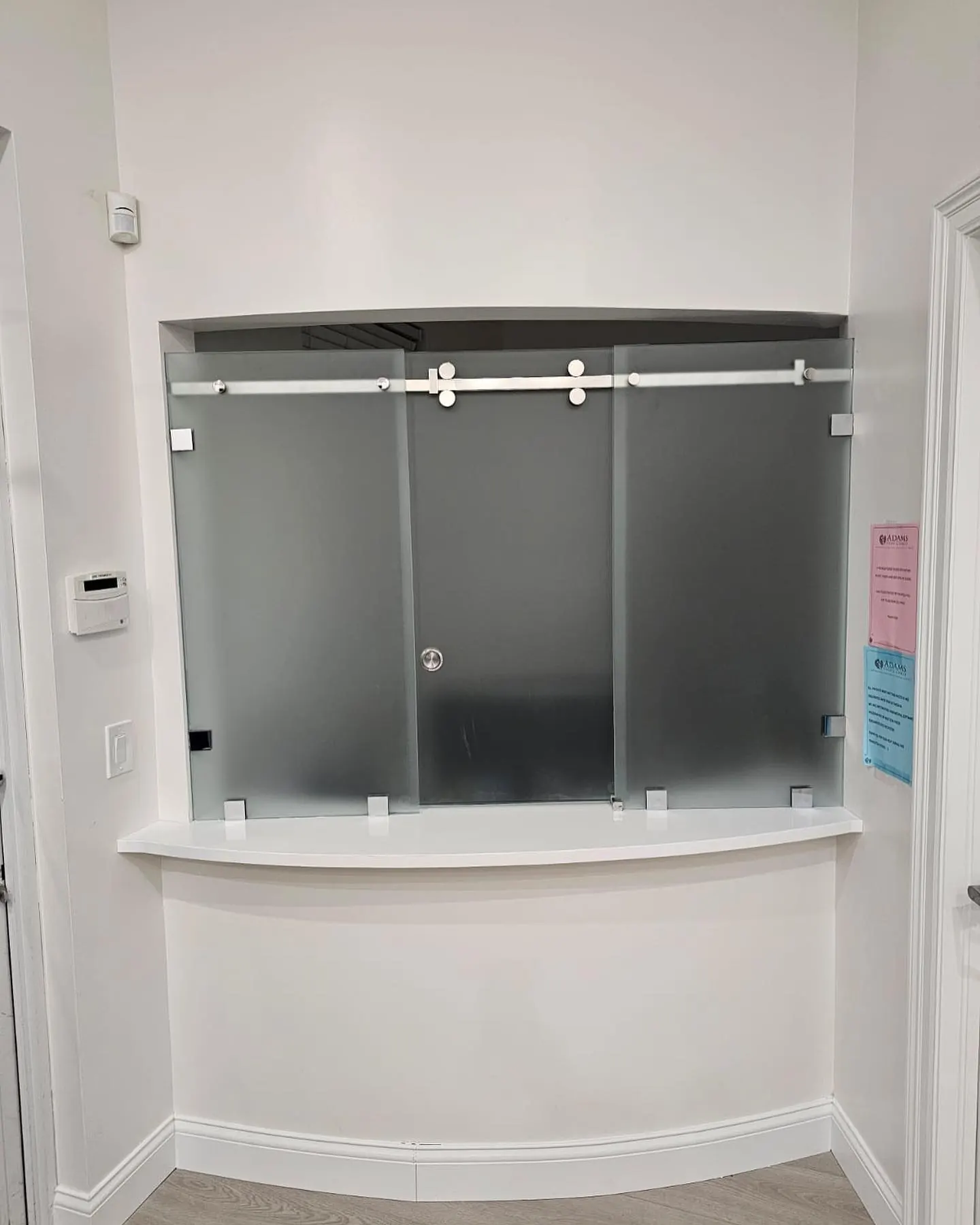 after office glass enclosure with chrome hardware in Southwest Florida