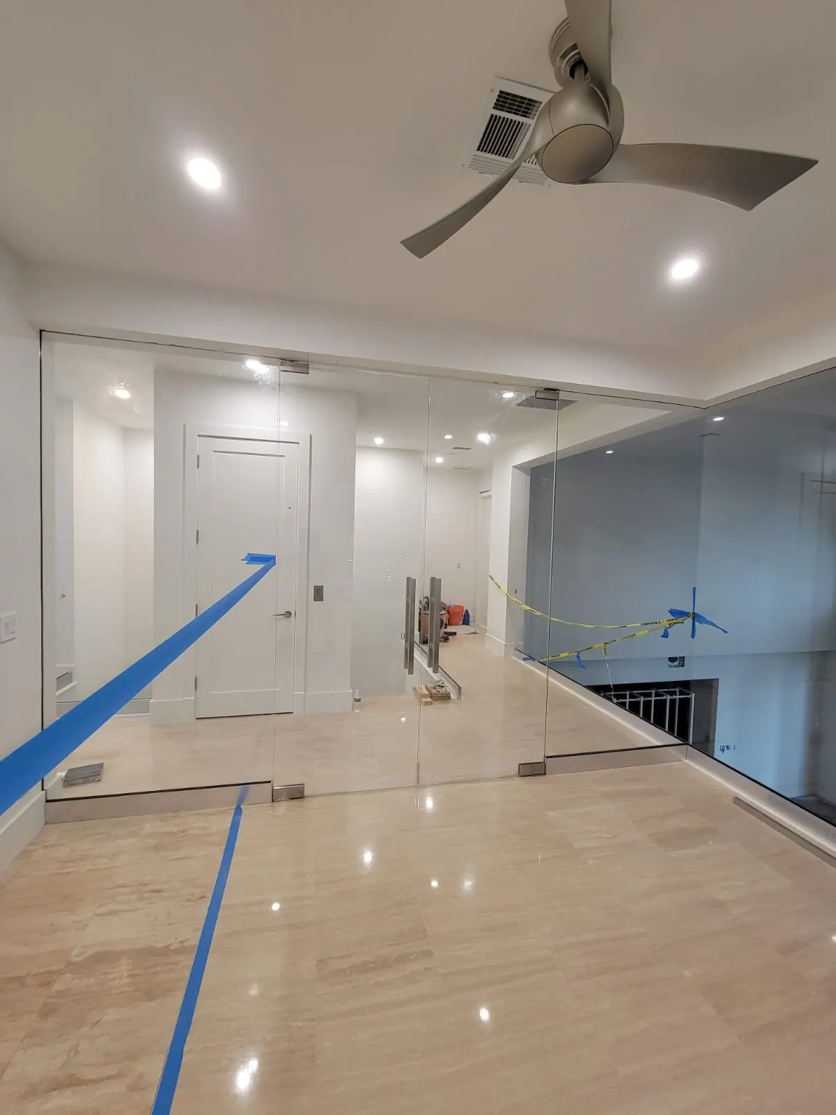 before office glass enclosure with chrome hardware in Southwest Florida