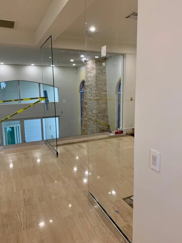 before office glass enclosure with chrome hardware in Southwest Florida