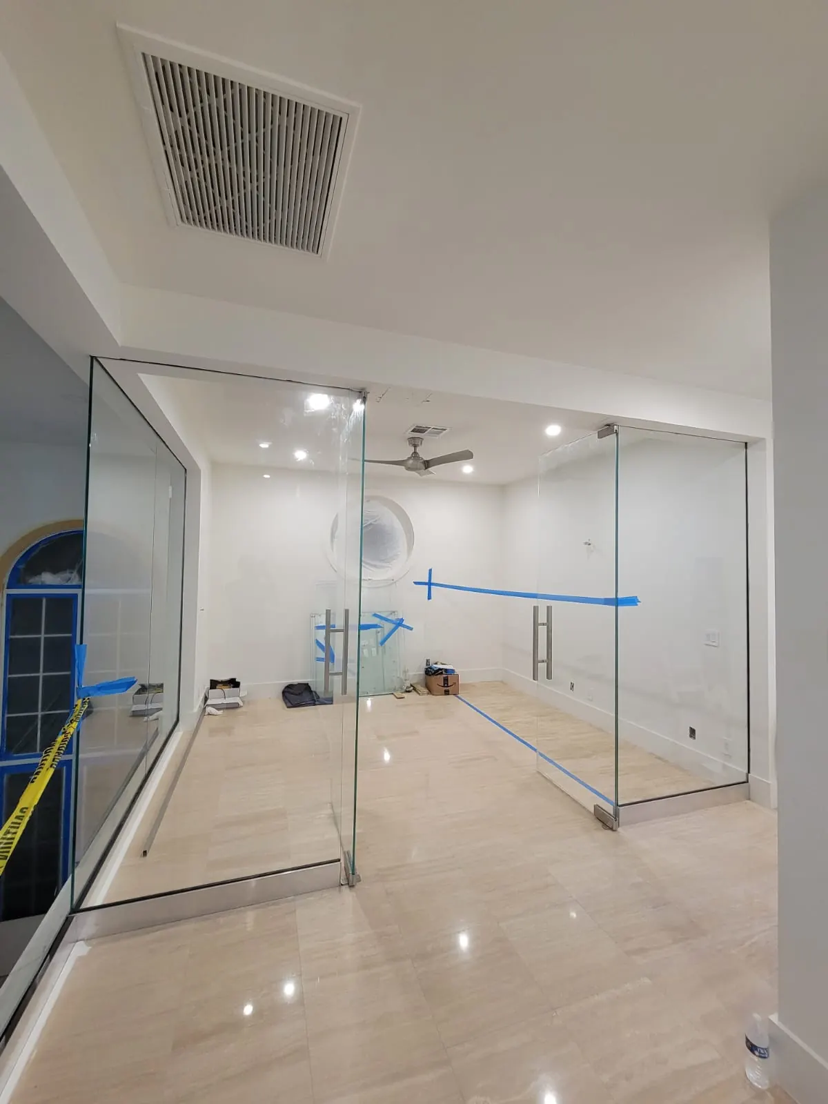 before office glass enclosure with chrome hardware in Southwest Florida