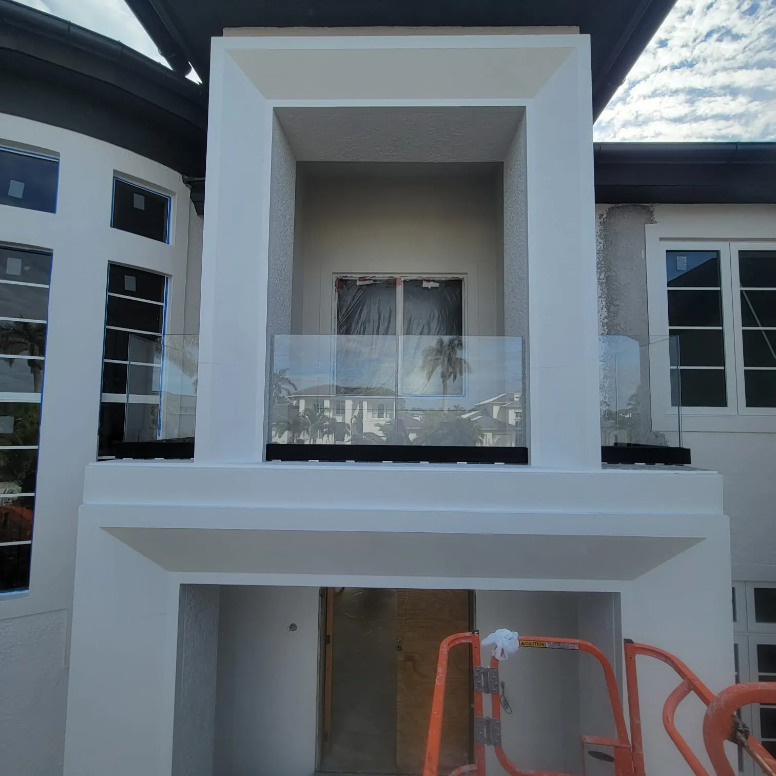 after ultra clear glass railing with black hardware in Southwest Florida