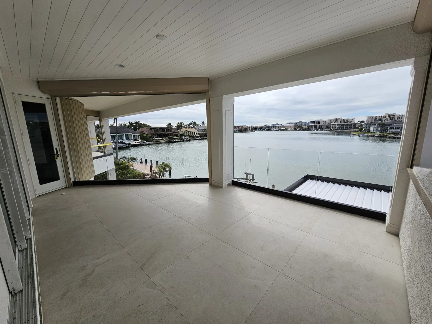 after ultra clear glass railing with black hardware in Southwest Florida