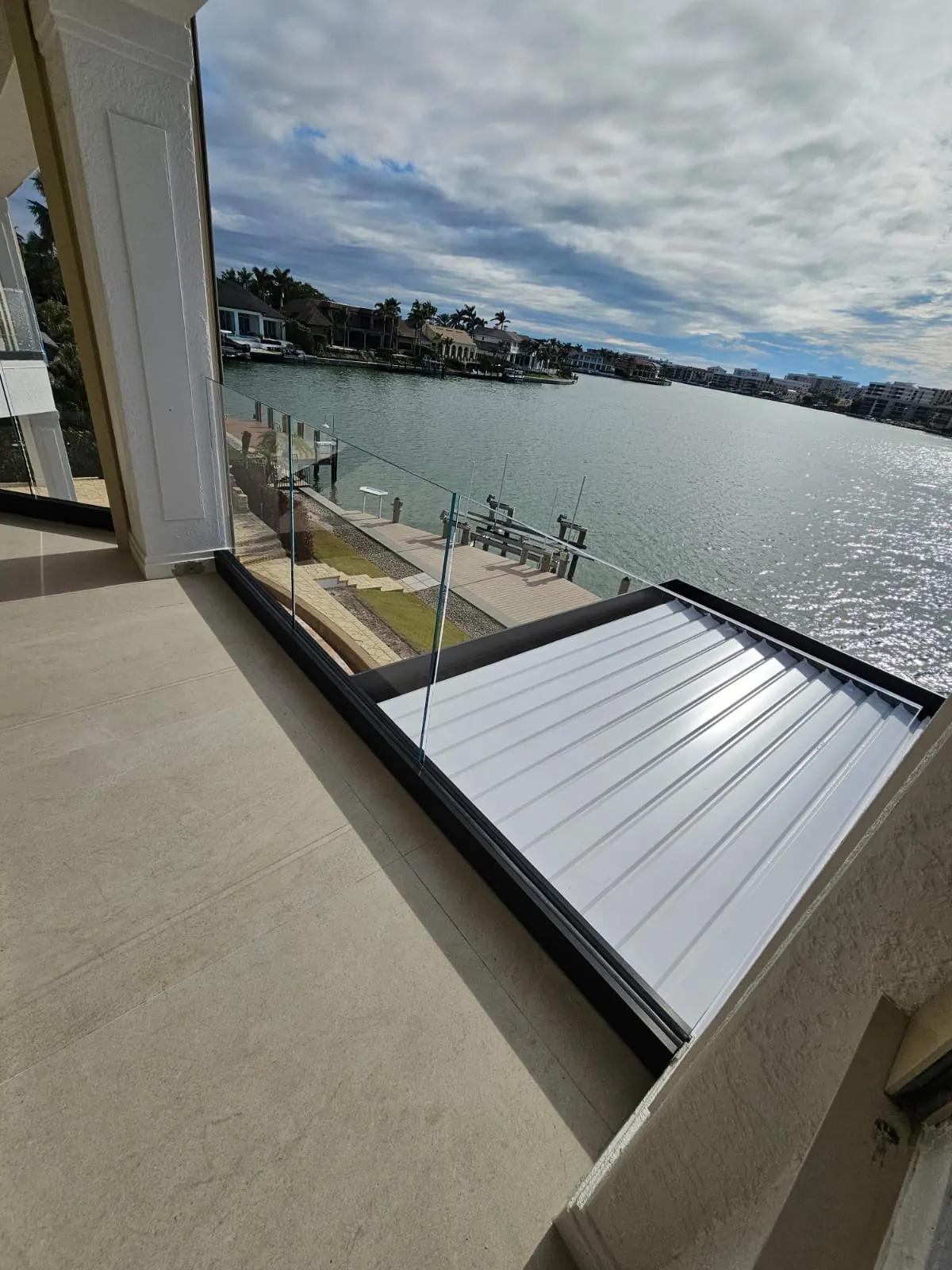 after ultra clear glass railing with black hardware in Southwest Florida