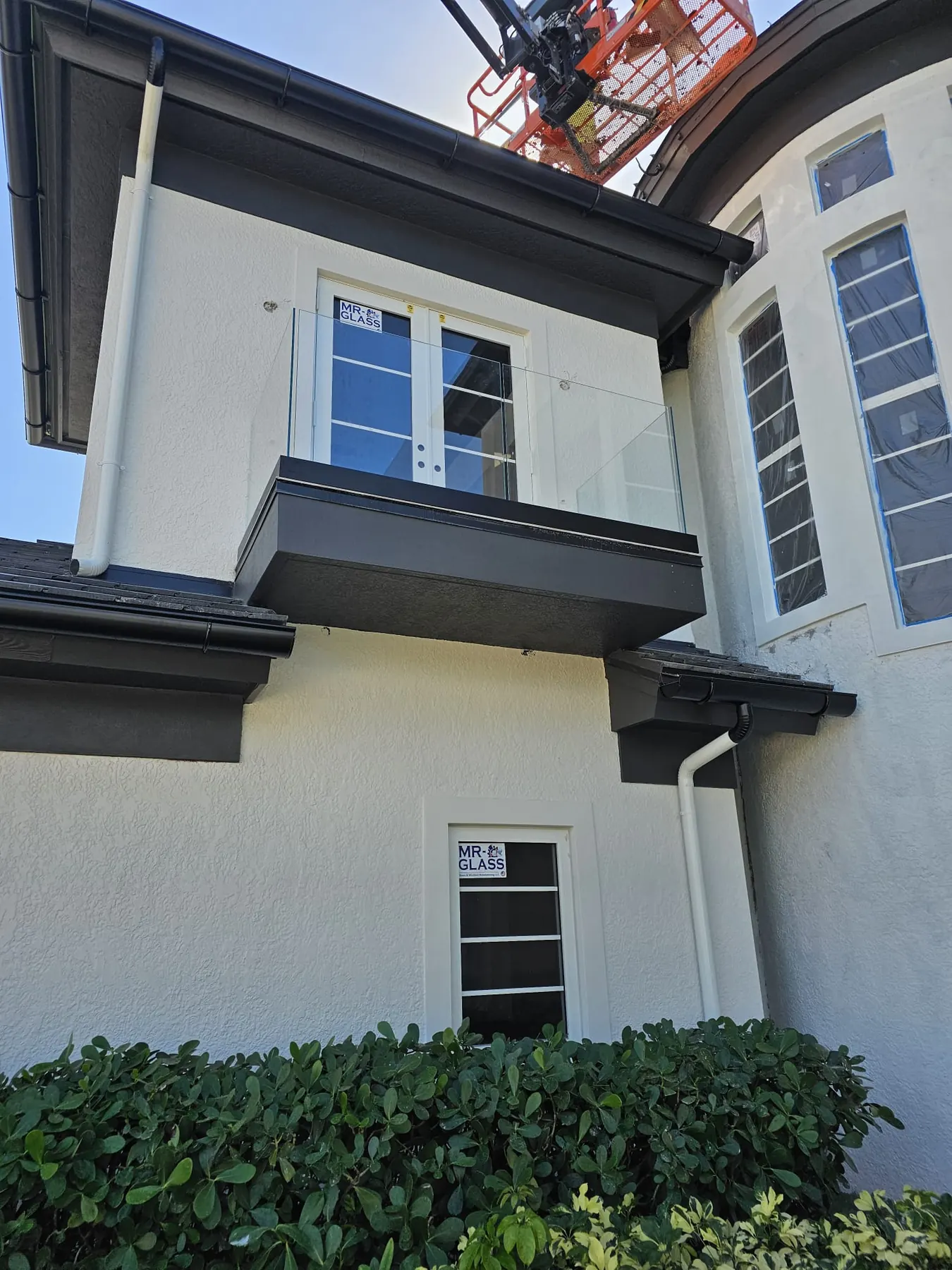 after ultra clear glass railing with black hardware in Southwest Florida