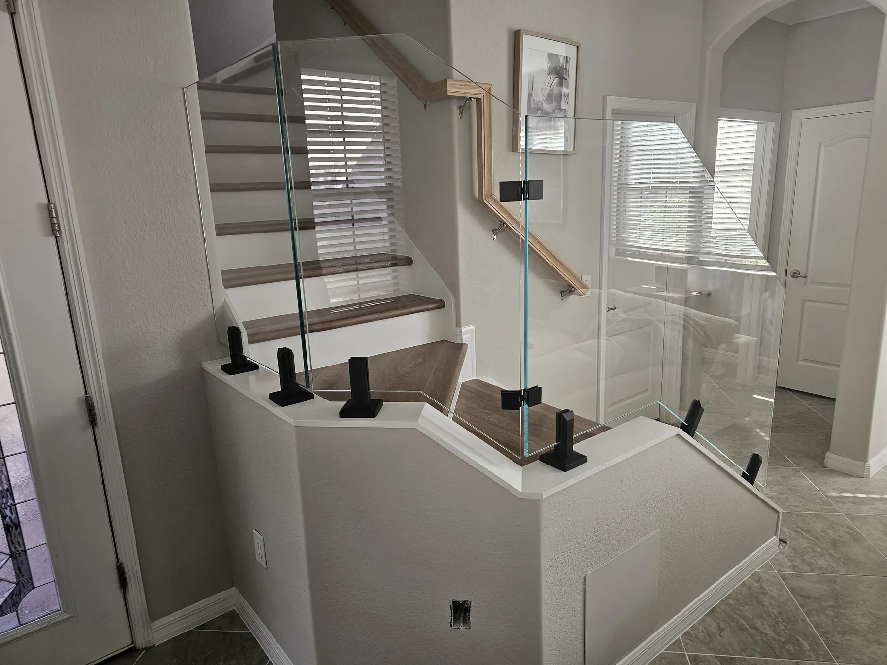 after ultra clear glass railing with black hardware in Southwest Florida