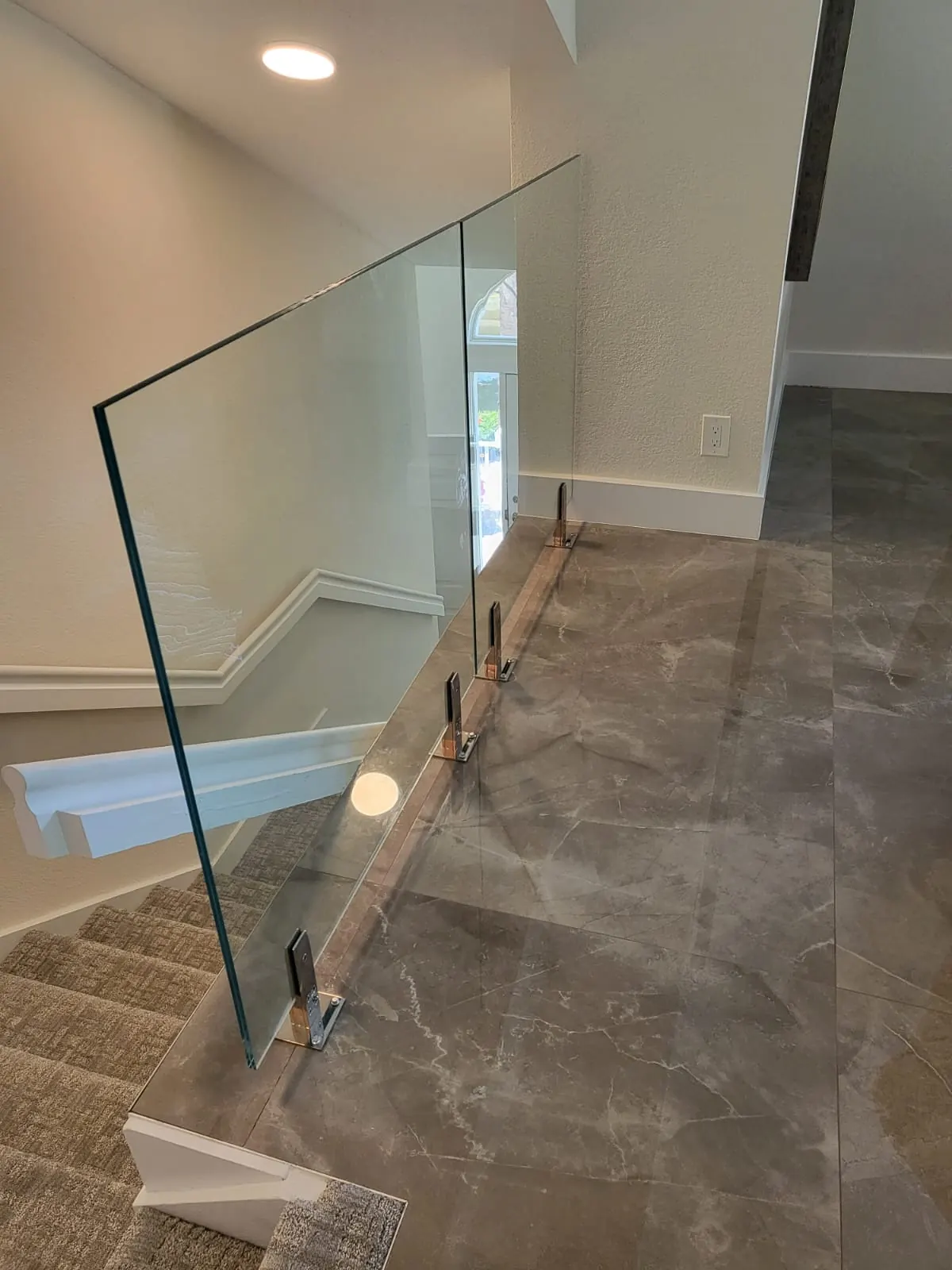 after clear glass railing with chrome hardware in Southwest Florida