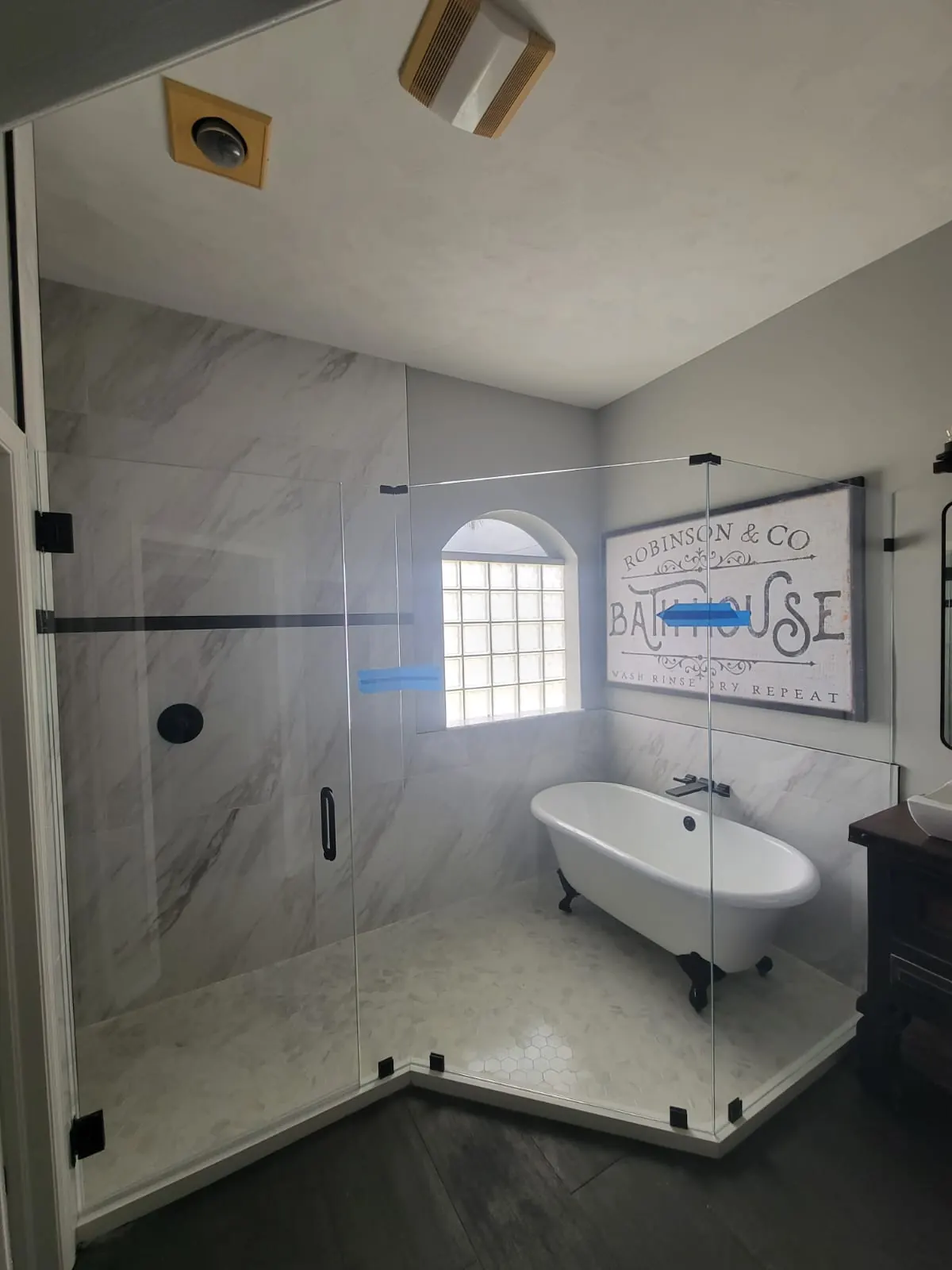 after frameless swing shower glass with black hardware in Southwest Florida