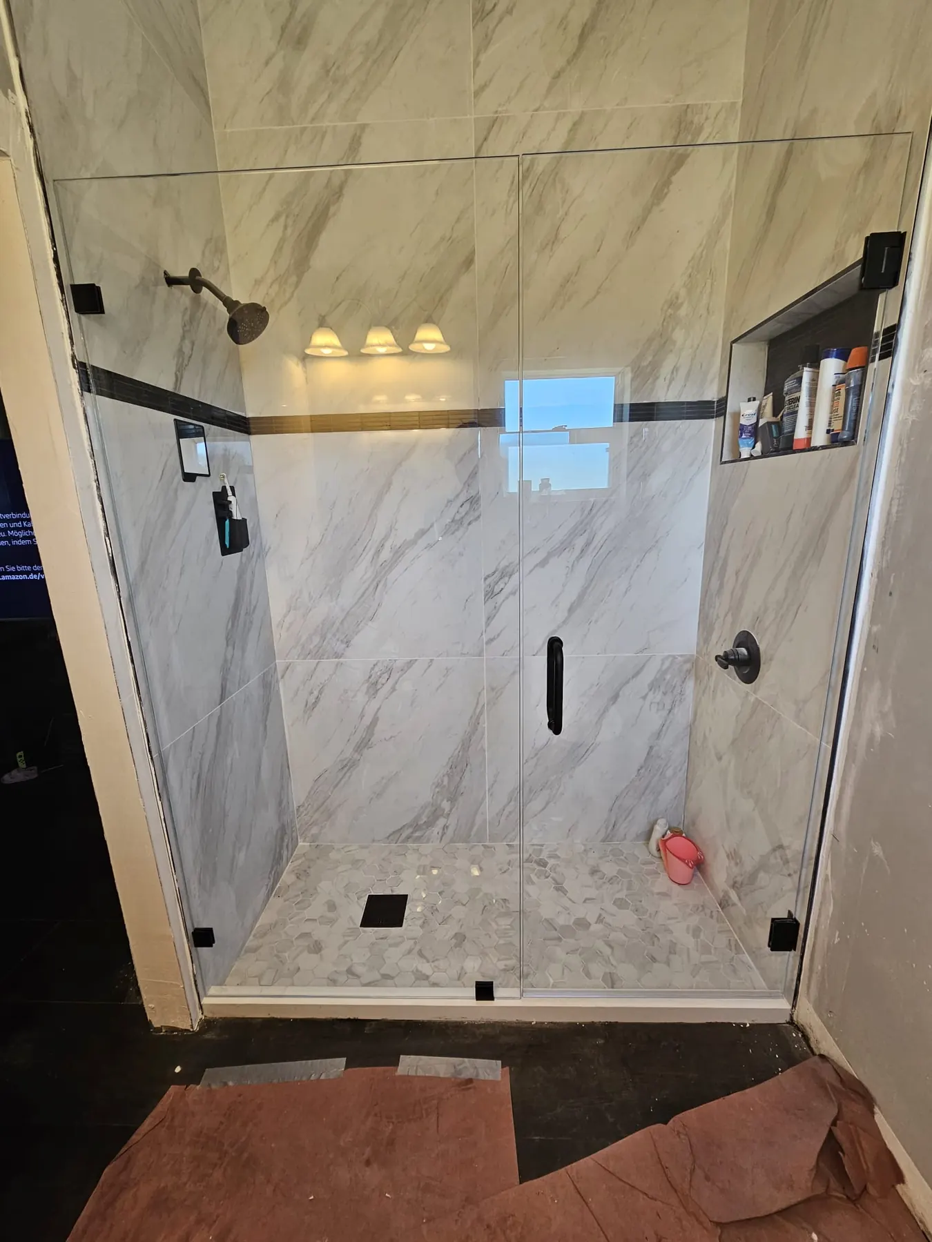 after frameless swing shower glass with black hardware in Southwest Florida