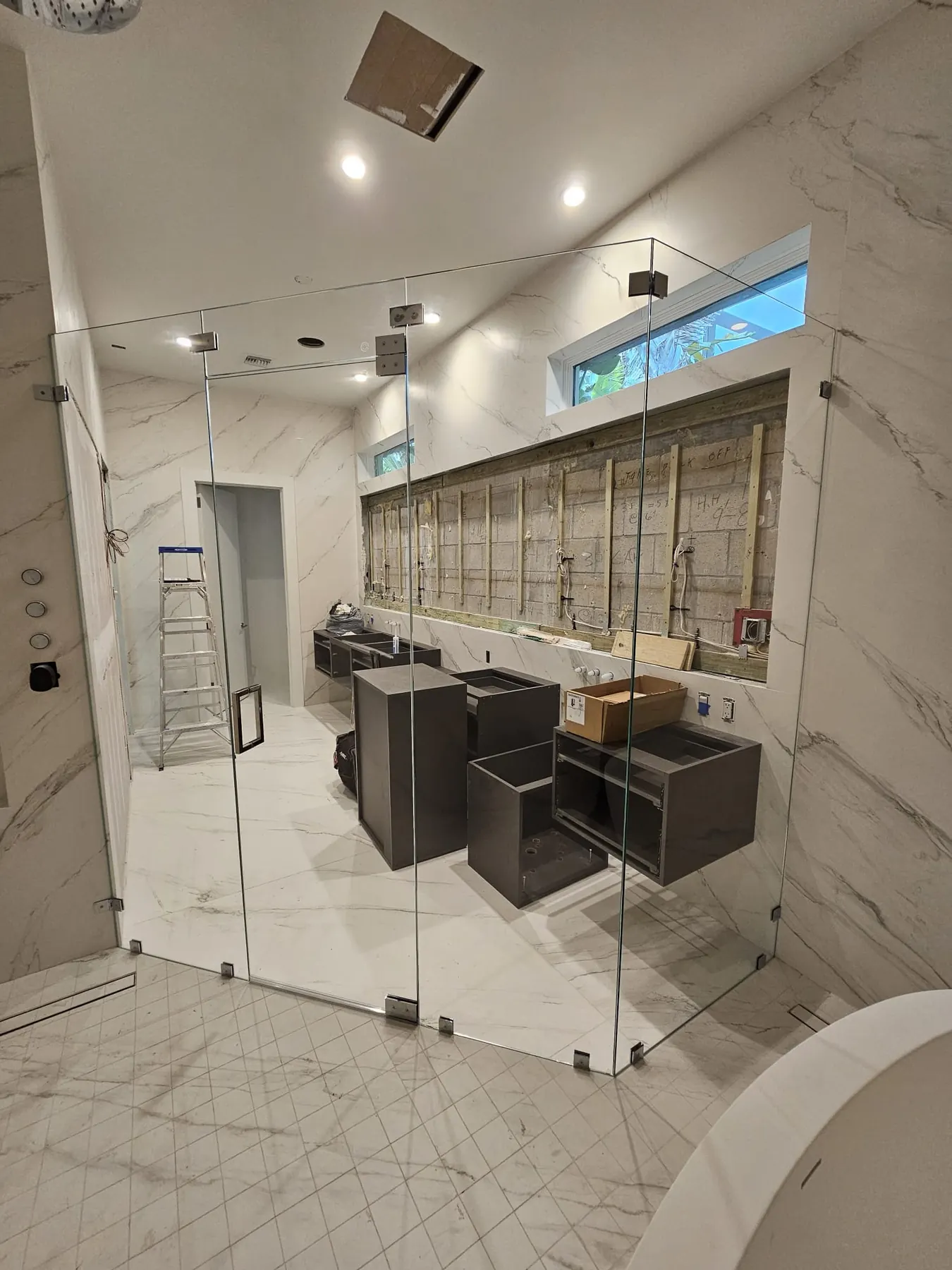 after frameless swing shower glass with chrome hardware in Southwest Florida