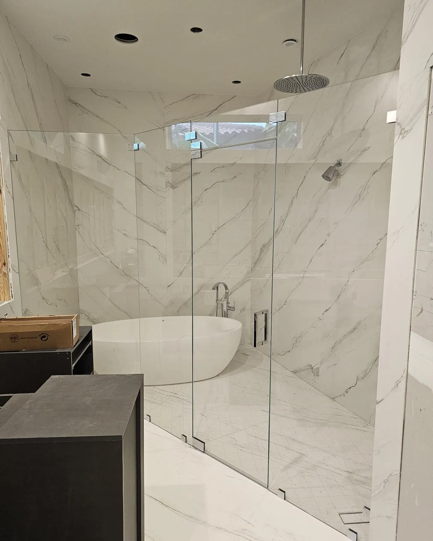 after frameless swing shower glass with chrome hardware in Southwest Florida