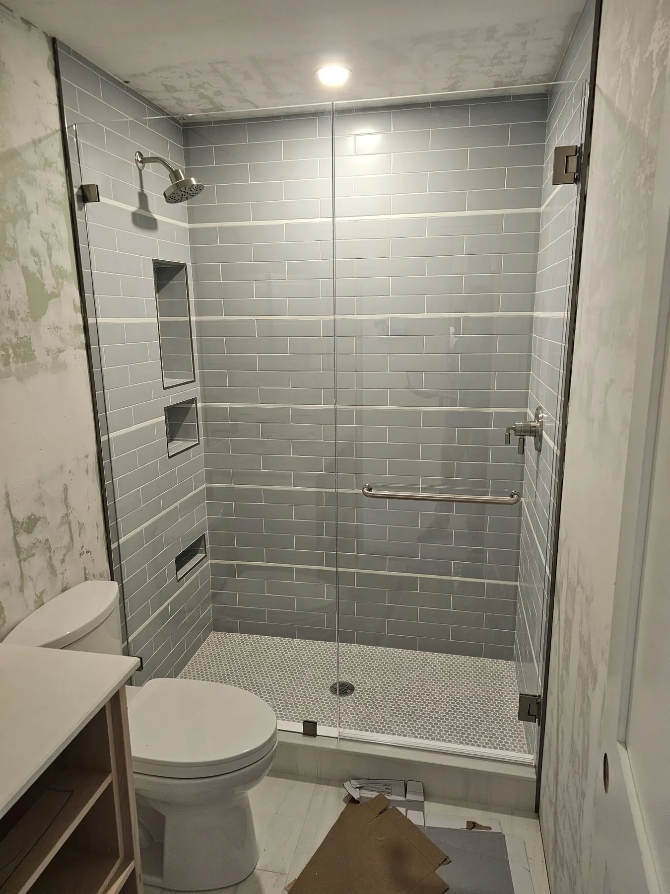 after frameless swing shower glass with chrome hardware in Southwest Florida