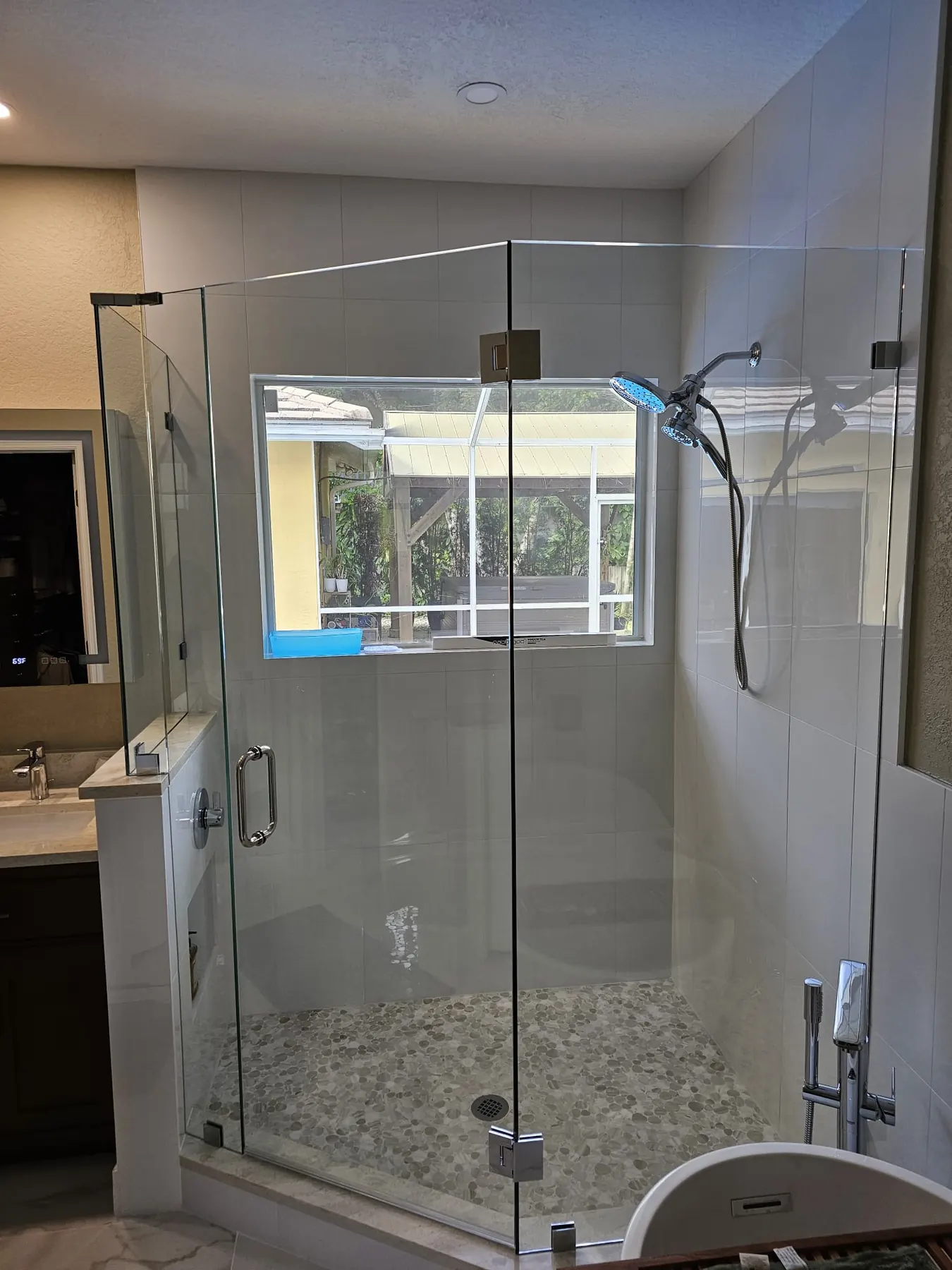 after frameless swing shower glass with chrome hardware in Southwest Florida