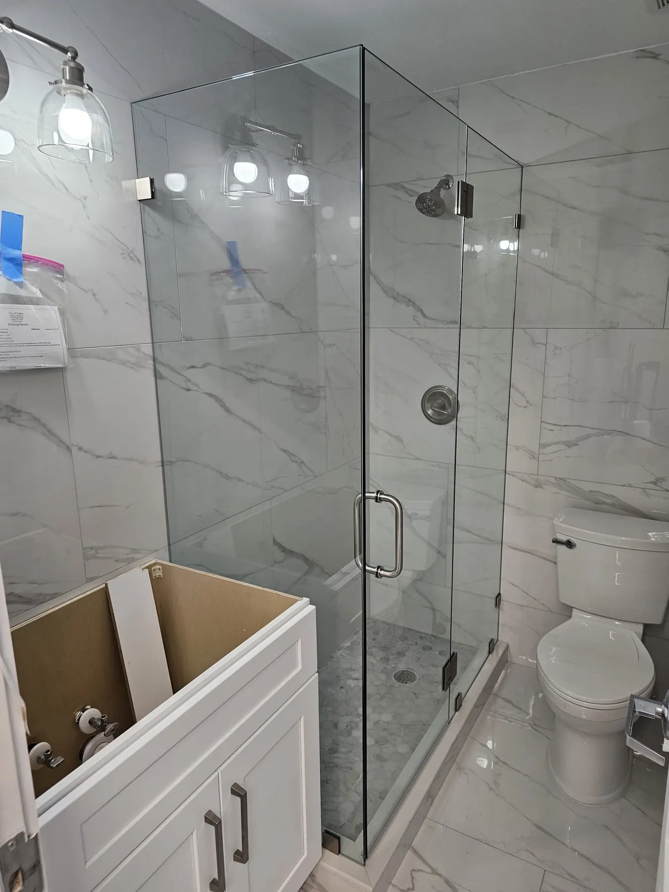 after frameless swing shower glass with chrome hardware in Southwest Florida