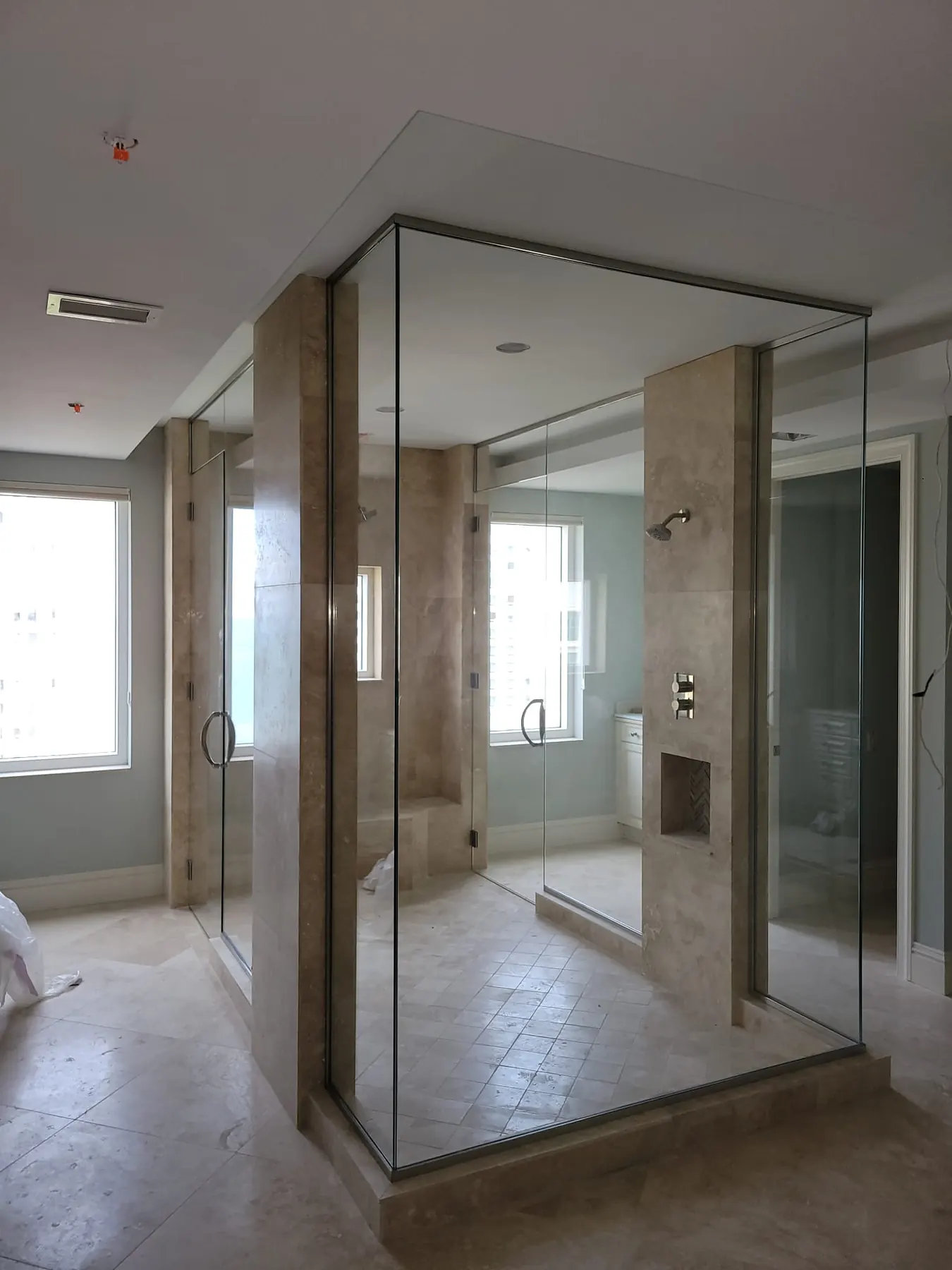 after frameless swing shower glass with chrome hardware in Southwest Florida