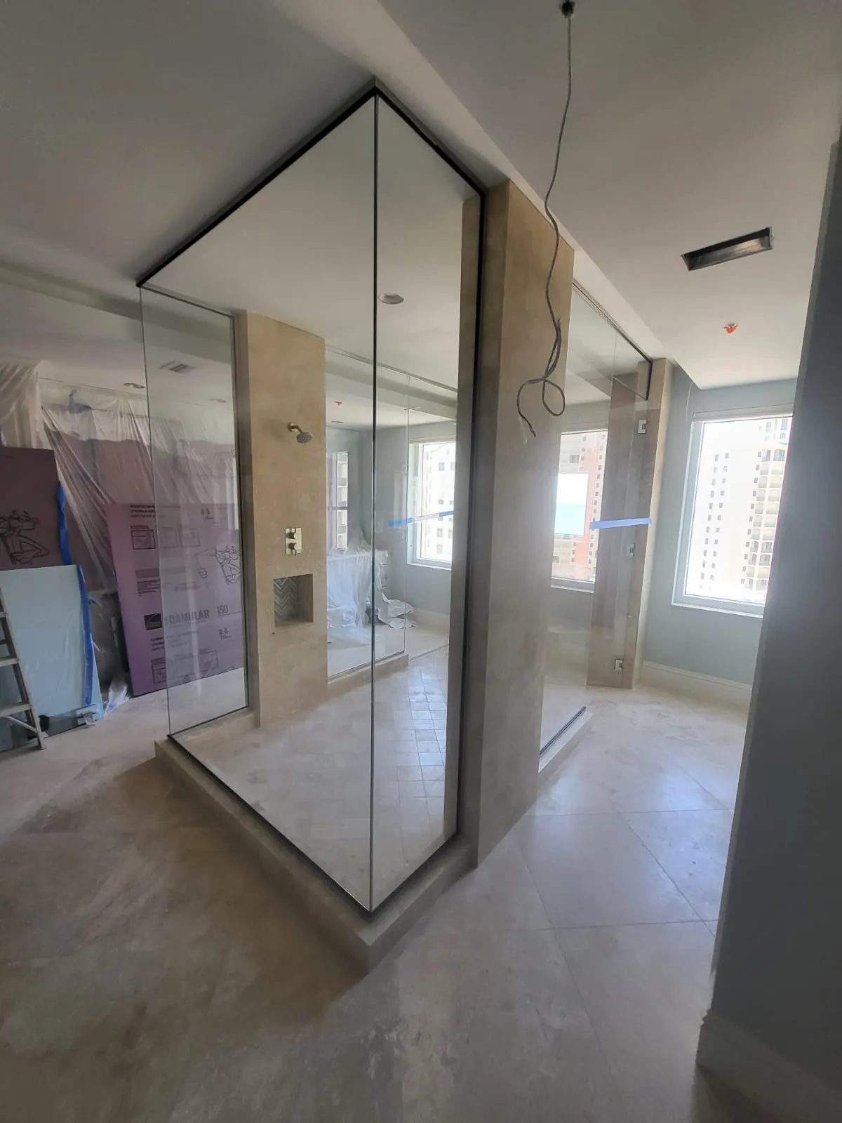 after frameless swing shower glass with chrome hardware in Southwest Florida