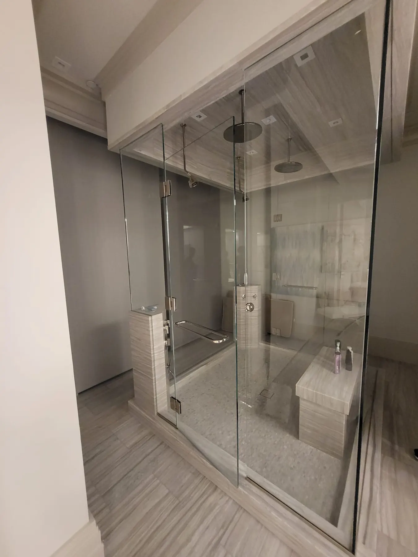 after frameless swing shower glass with chrome hardware in Southwest Florida
