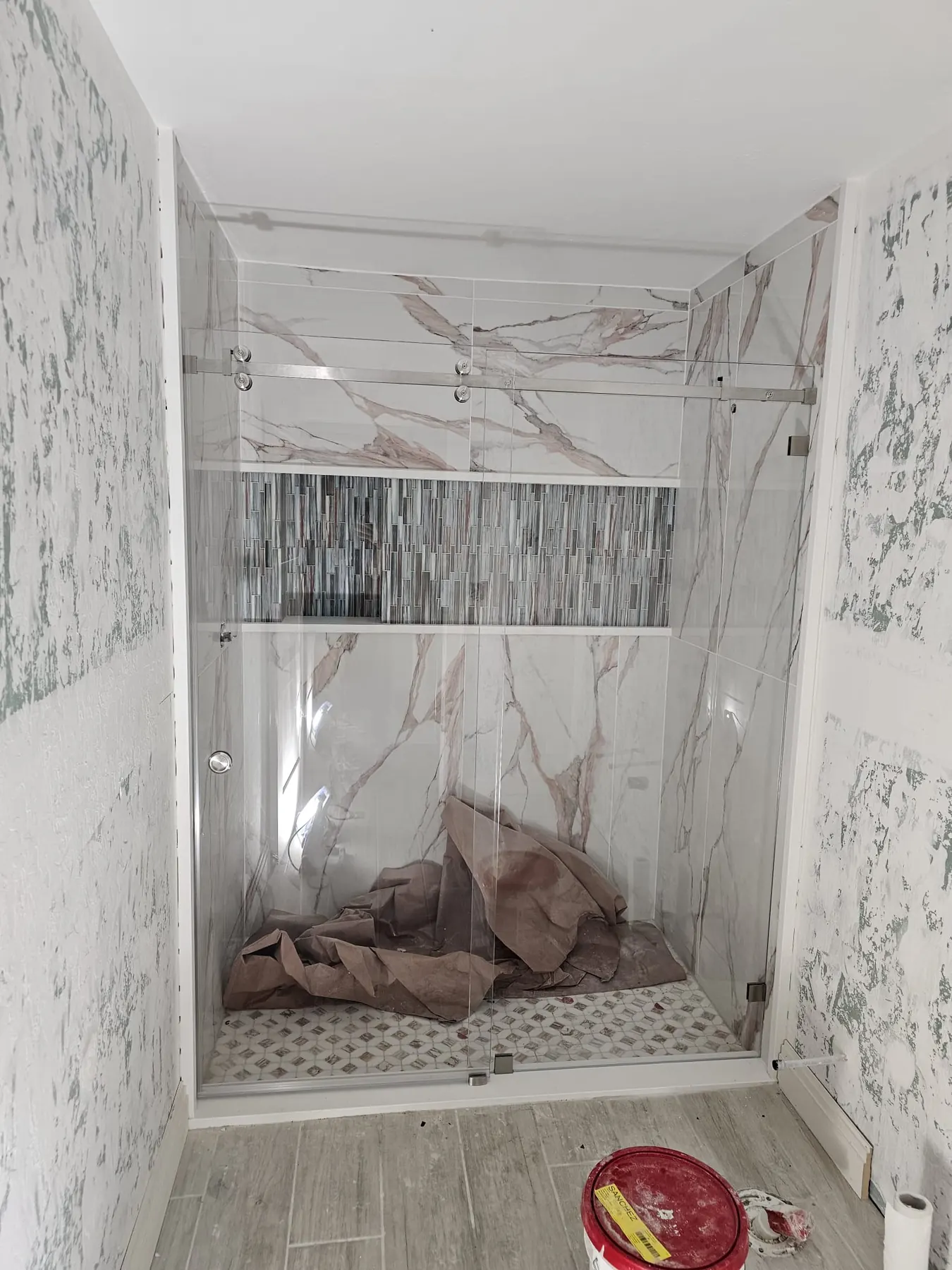 after frameless sliding shower glass with chrome hardware in Southwest Florida
