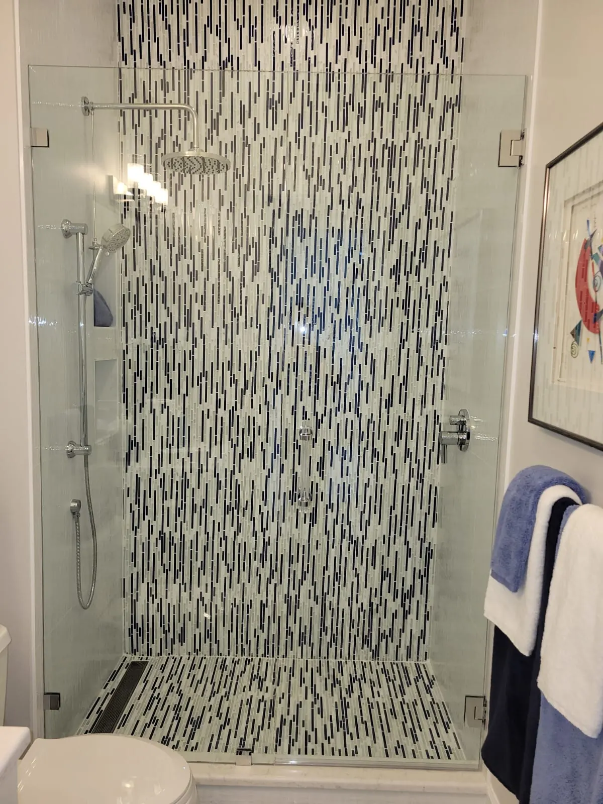 after frameless swing shower glass with chrome hardware in Southwest Florida