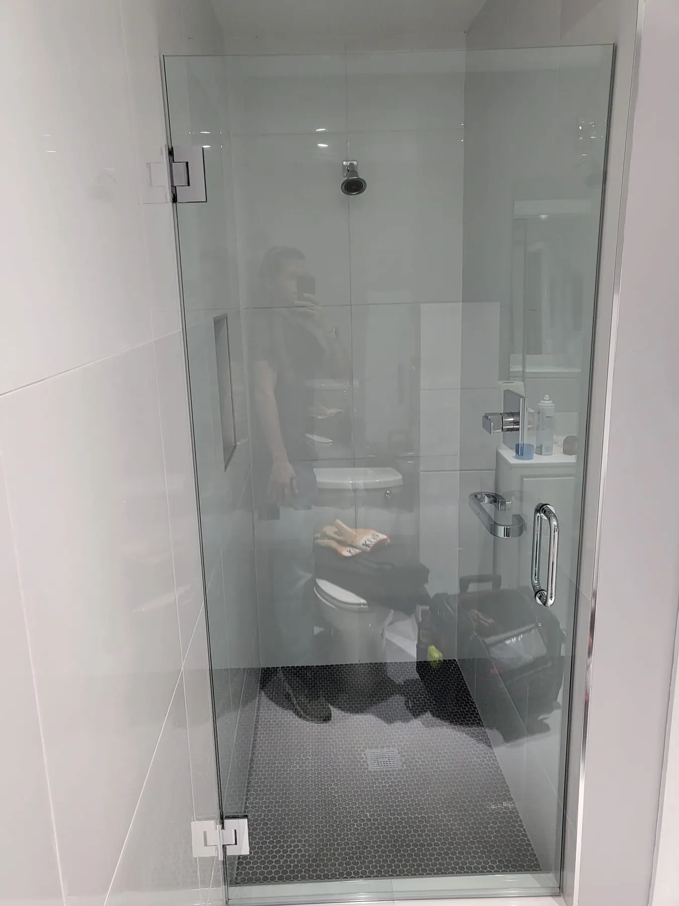after frameless swing shower glass with chrome hardware in Southwest Florida