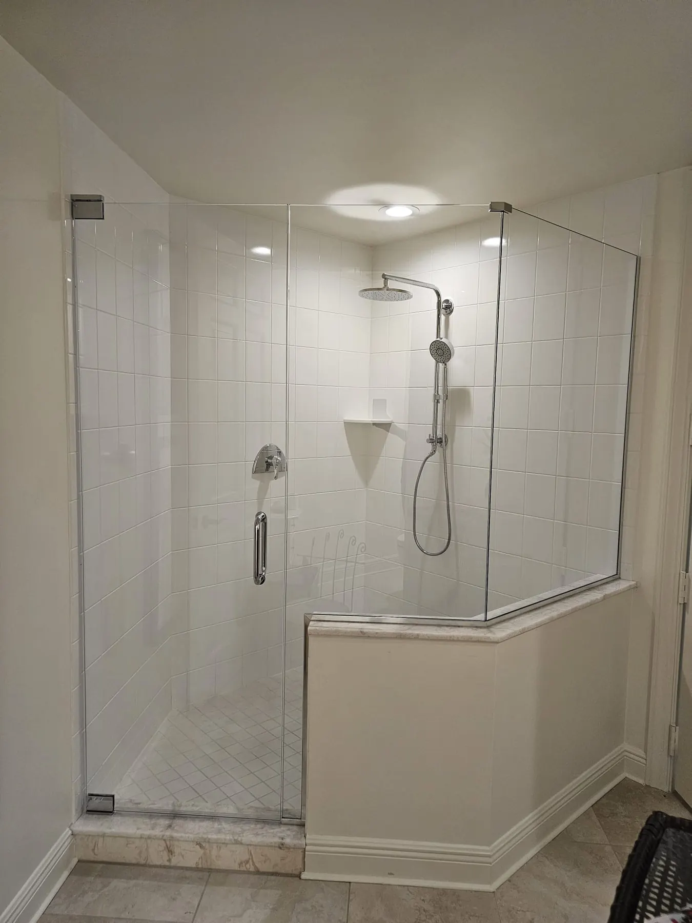 after frameless swing shower glass with chrome hardware in Southwest Florida