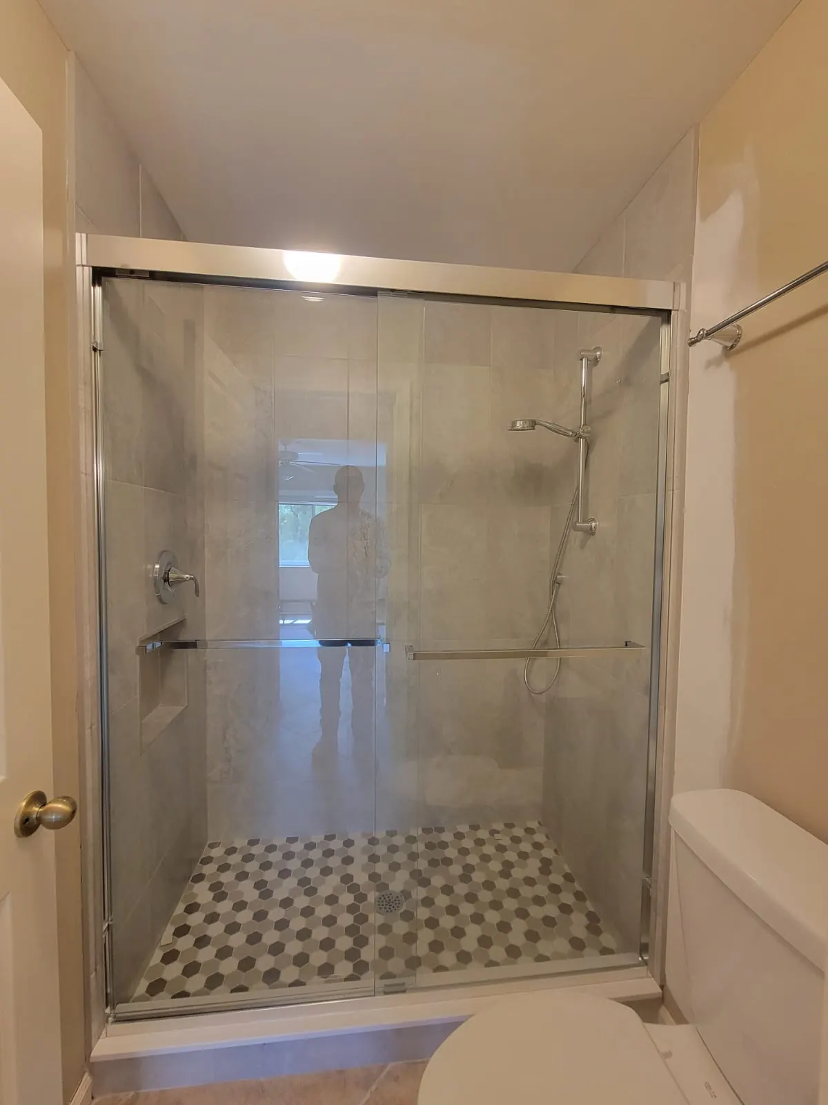 after frameless sliding shower glass with chrome hardware in Southwest Florida