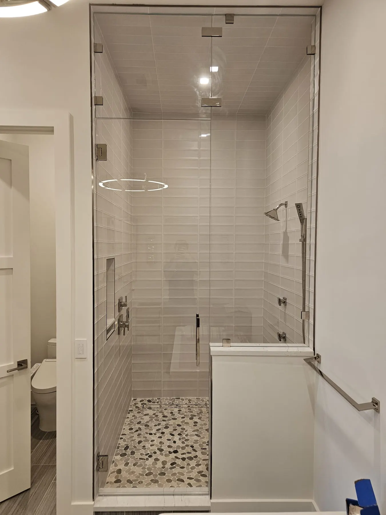 after frameless swing shower glass with chrome hardware in Southwest Florida