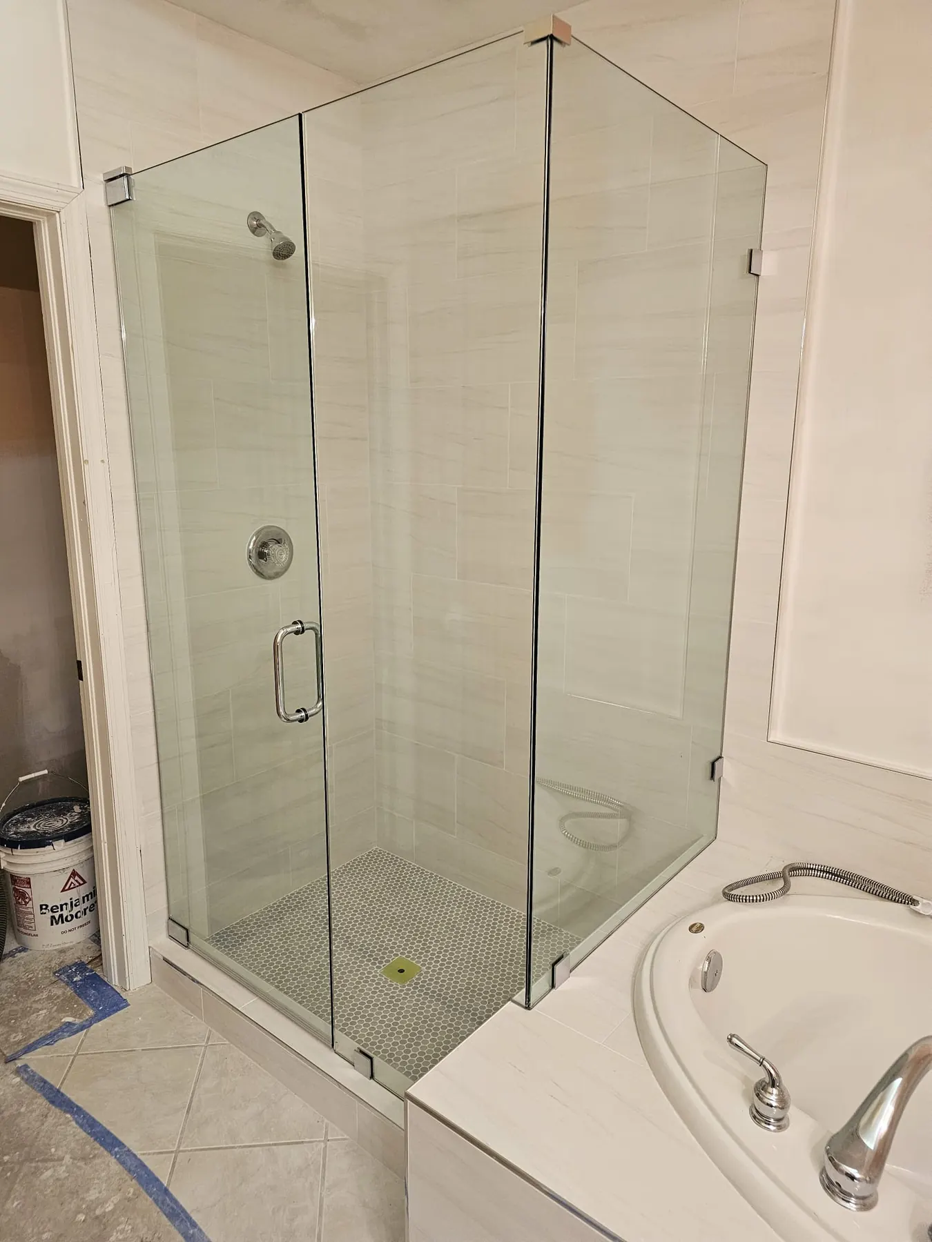 after frameless swing shower glass with chrome hardware in Southwest Florida
