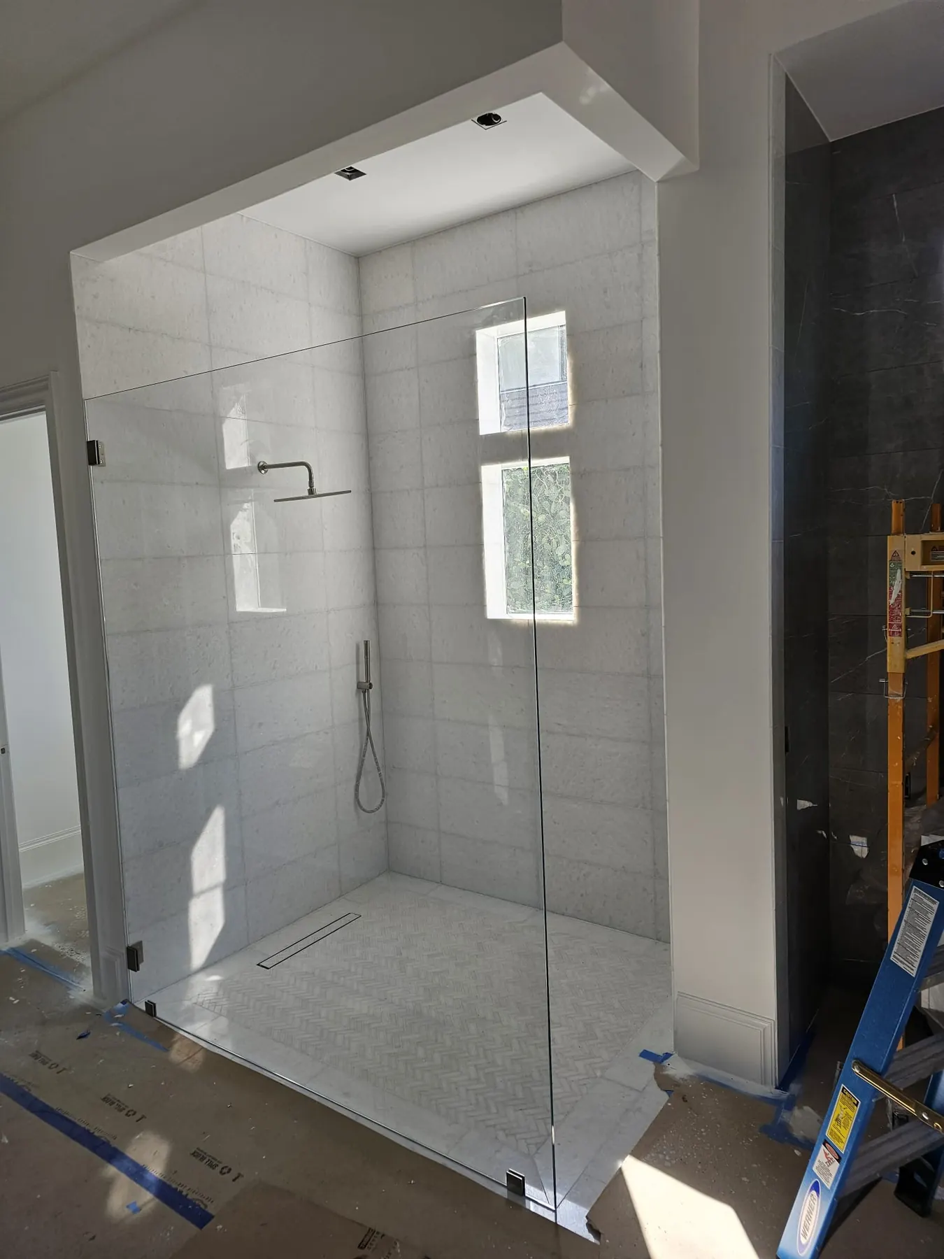 after frameless shower glass with chrome hardware in Southwest Florida