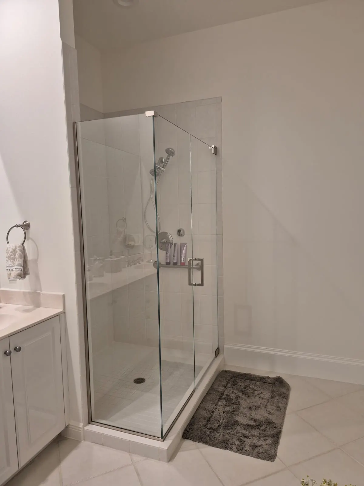 after frameless swing shower glass with chrome hardware in Southwest Florida