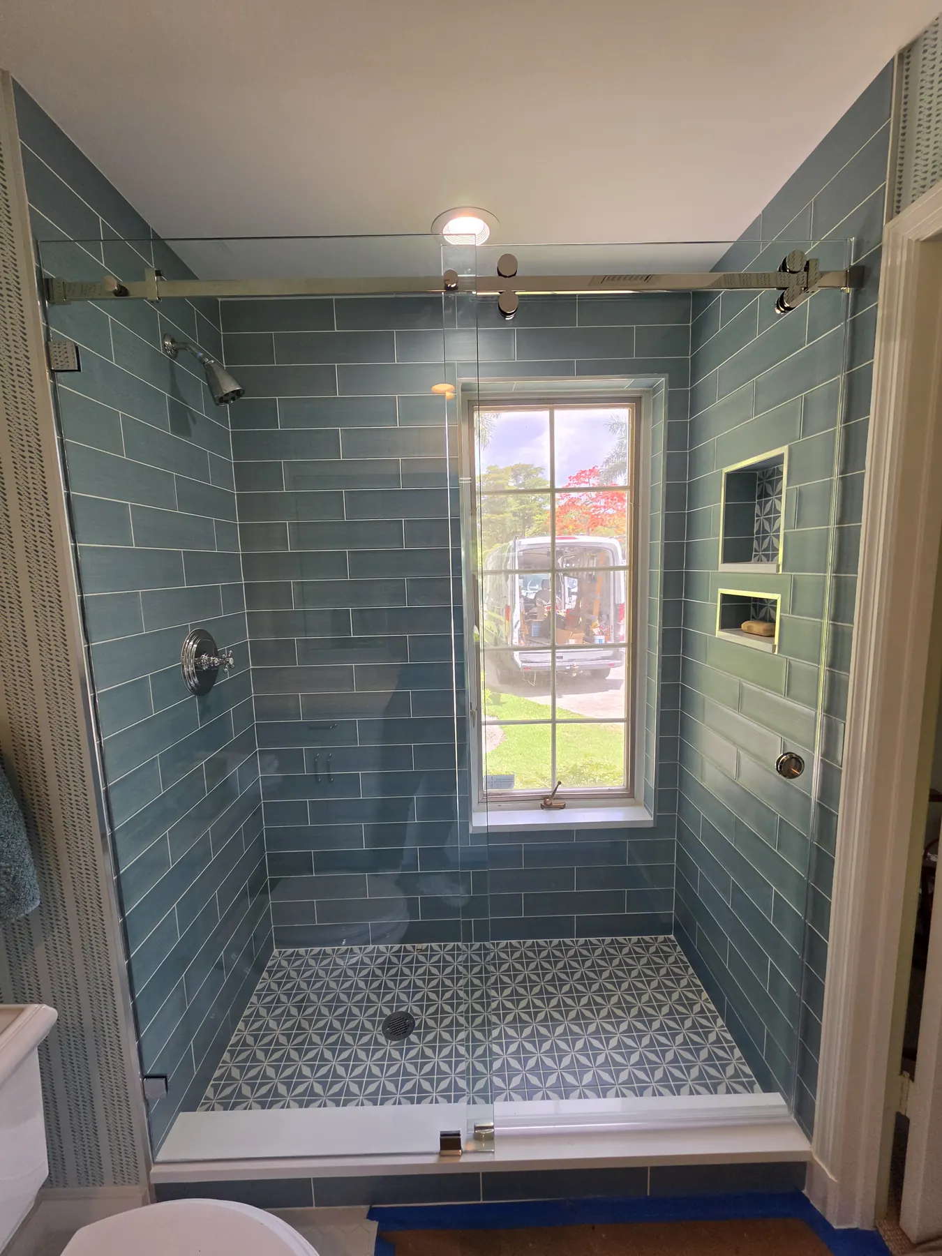 after frameless sliding shower glass with chrome hardware in Southwest Florida