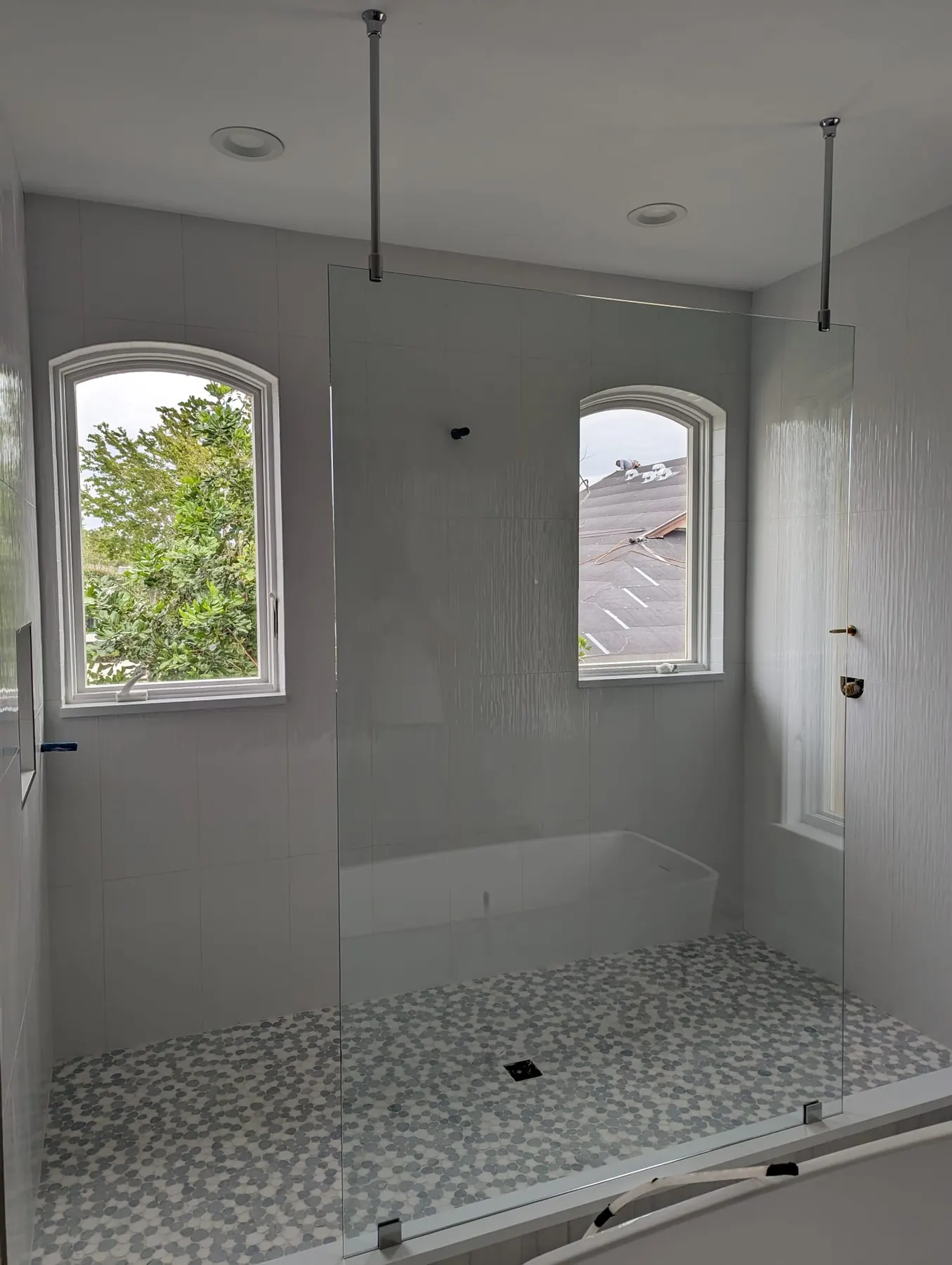 after frameless shower glass with chrome hardware in Southwest Florida