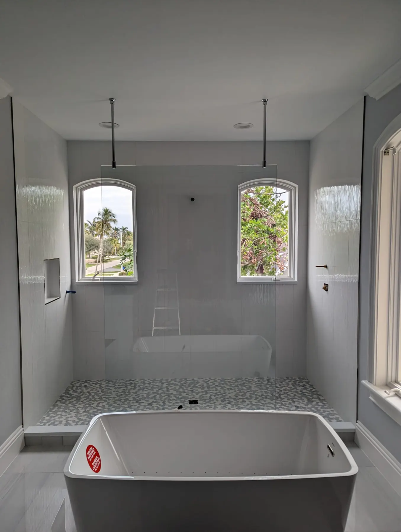 after frameless shower glass with chrome hardware in Southwest Florida