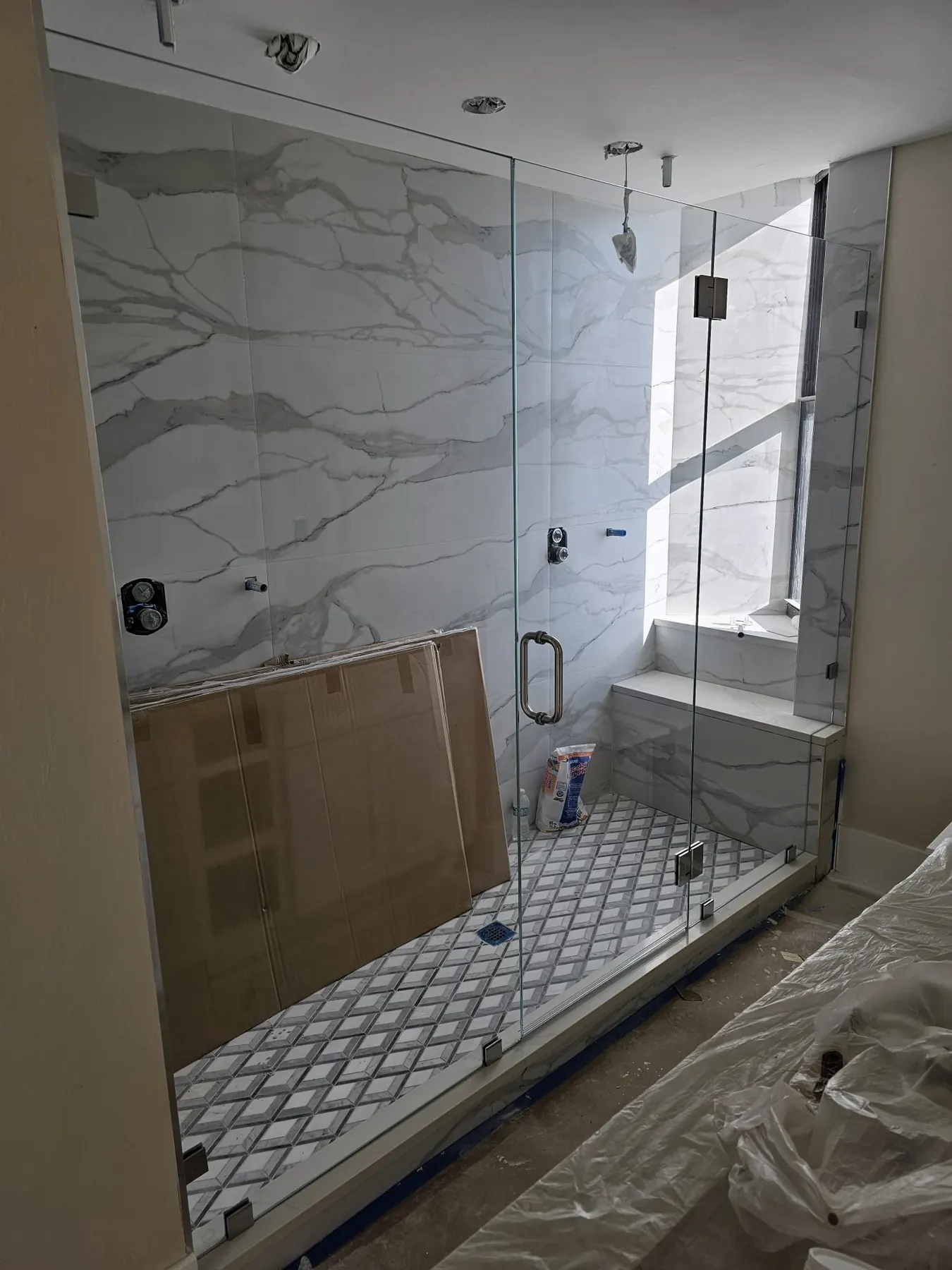 after frameless swing shower glass with chrome hardware in Southwest Florida