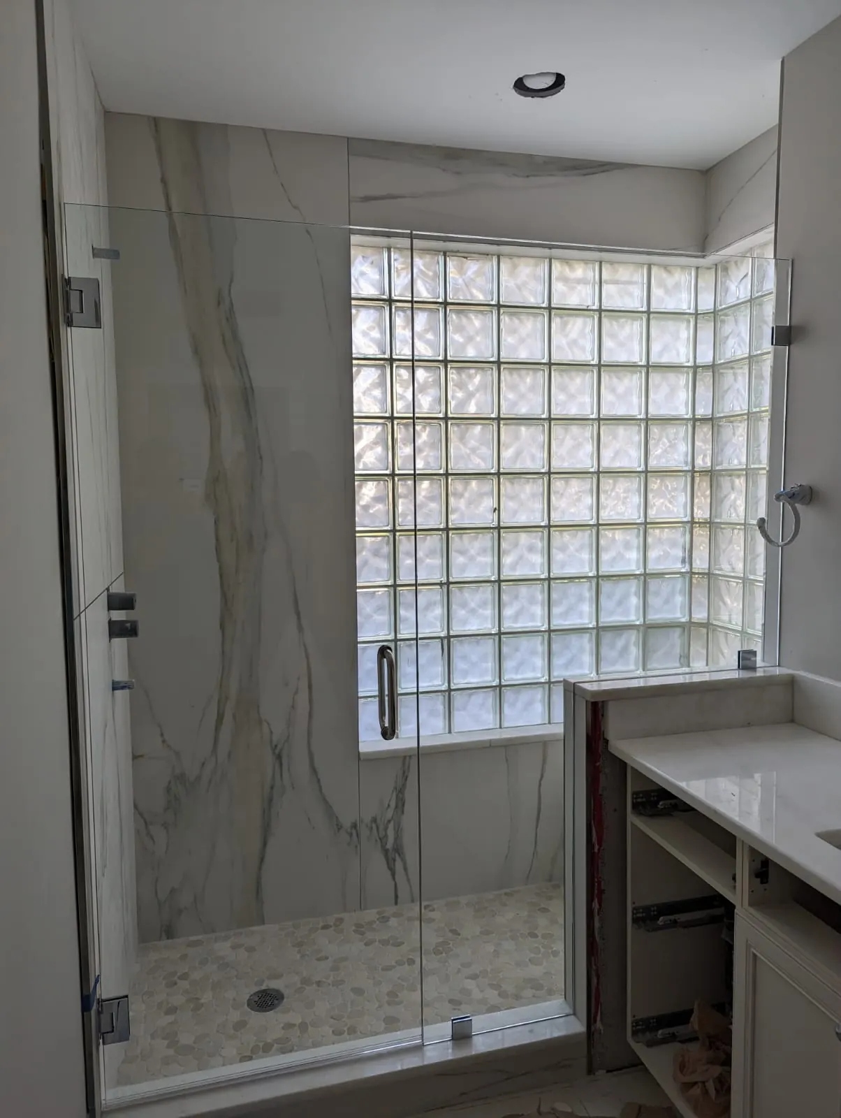 after frameless swing shower glass with chrome hardware in Southwest Florida