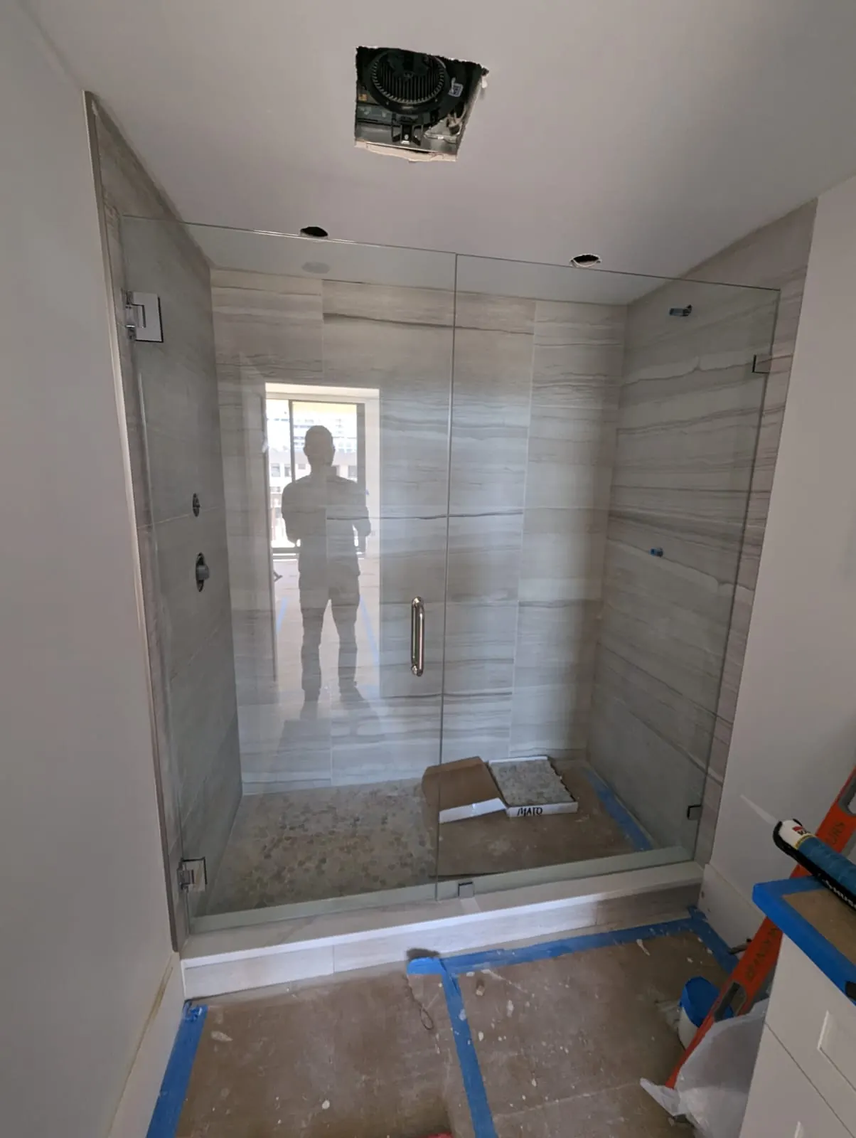 after frameless swing shower glass with chrome hardware in Southwest Florida