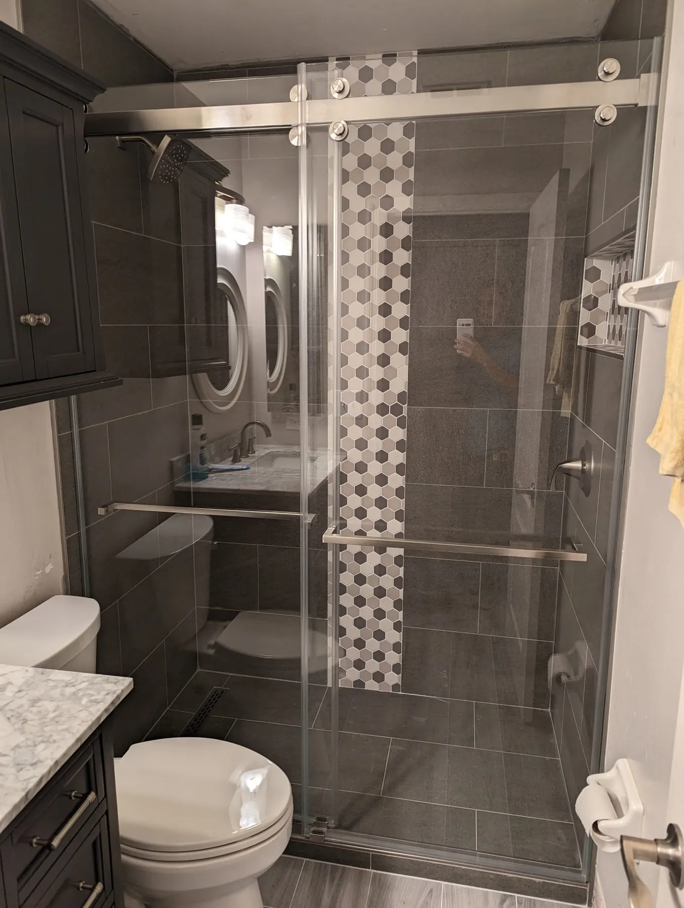 after frameless sliding shower glass with chrome hardware in Southwest Florida