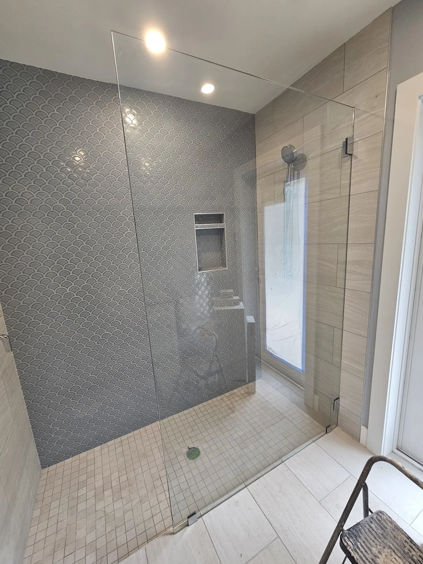 after frameless shower glass with chrome hardware in Southwest Florida