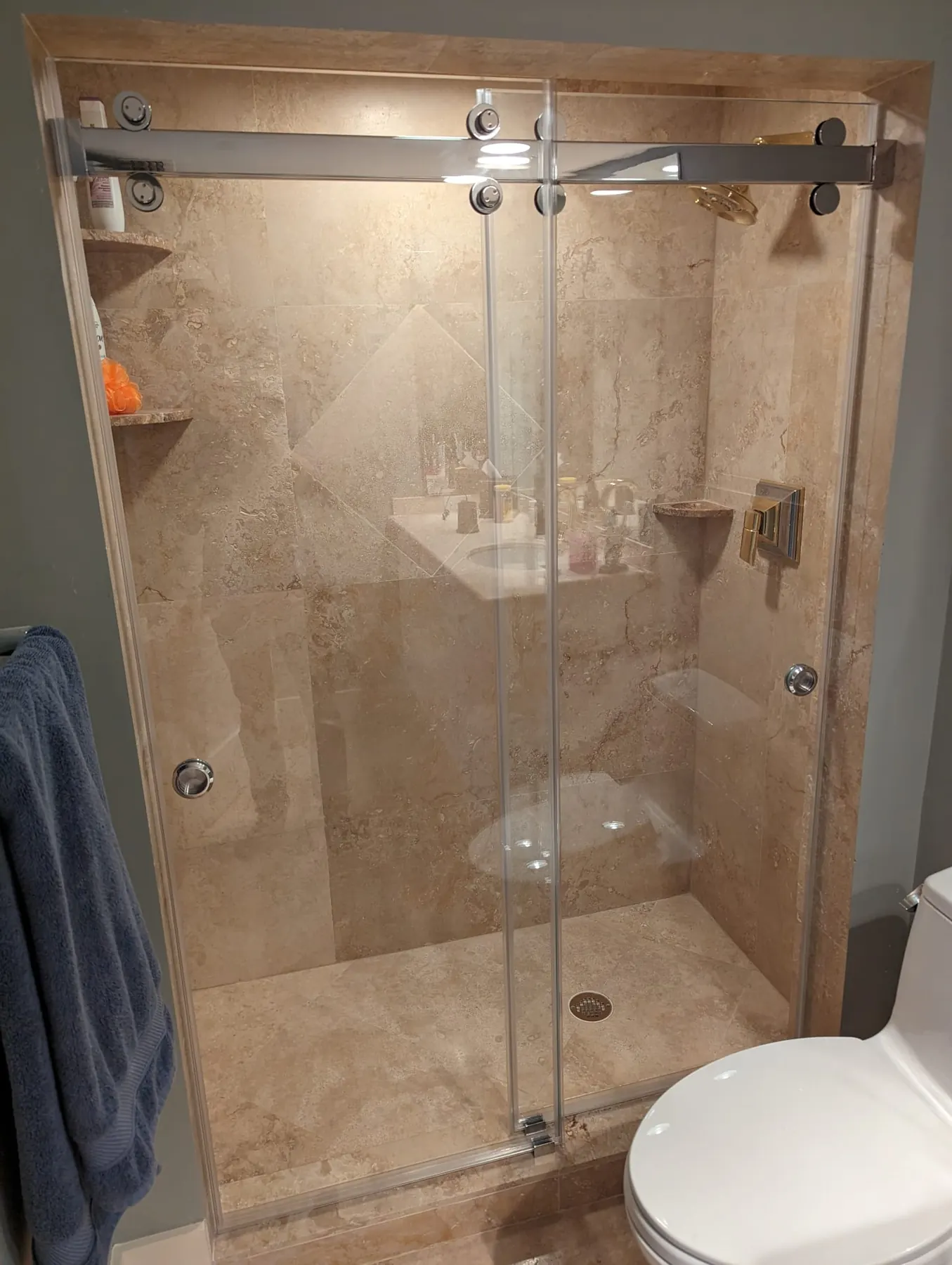 after frameless sliding shower glass with chrome hardware in Southwest Florida