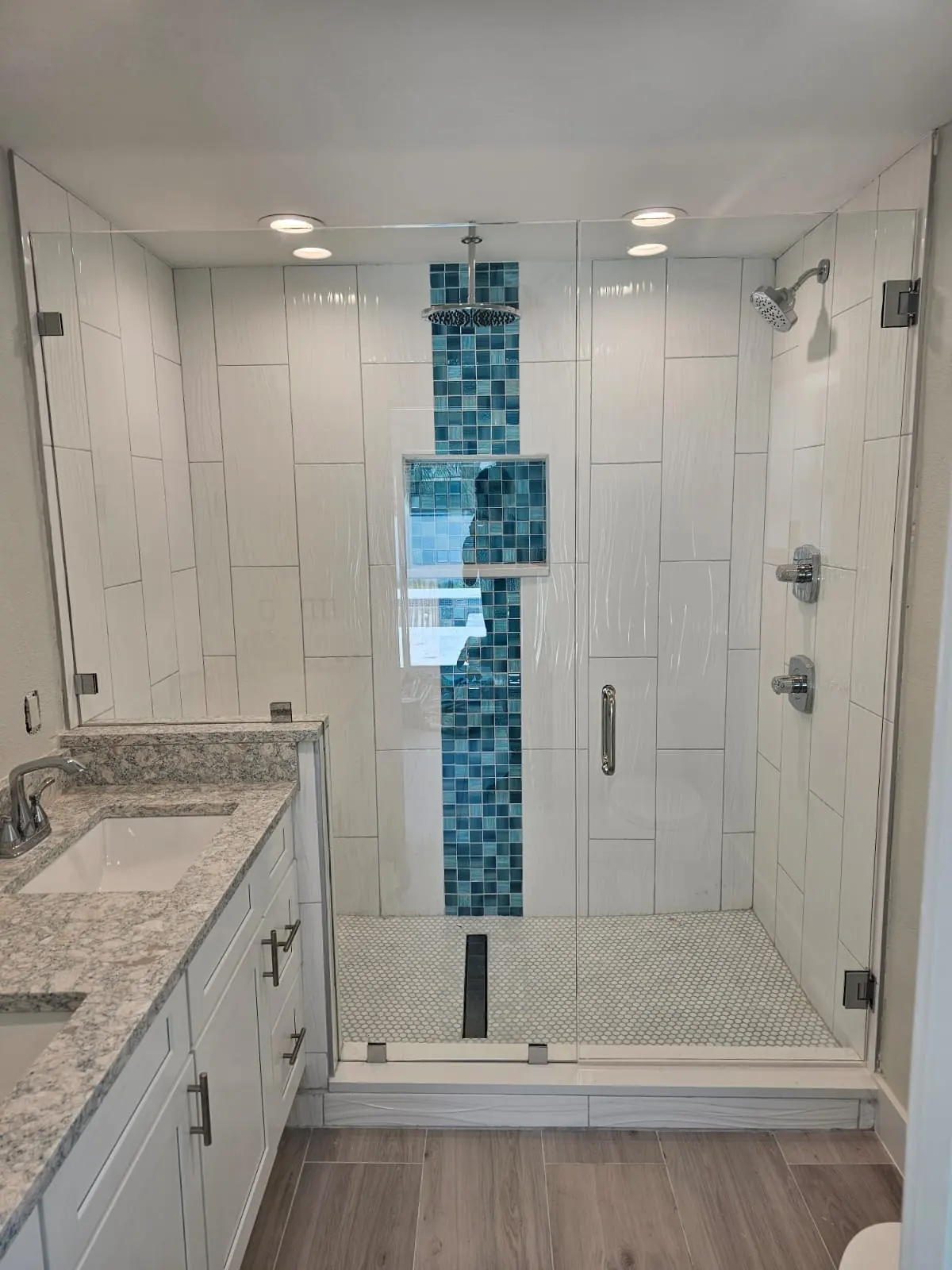 after frameless swing shower glass with chrome hardware in Southwest Florida