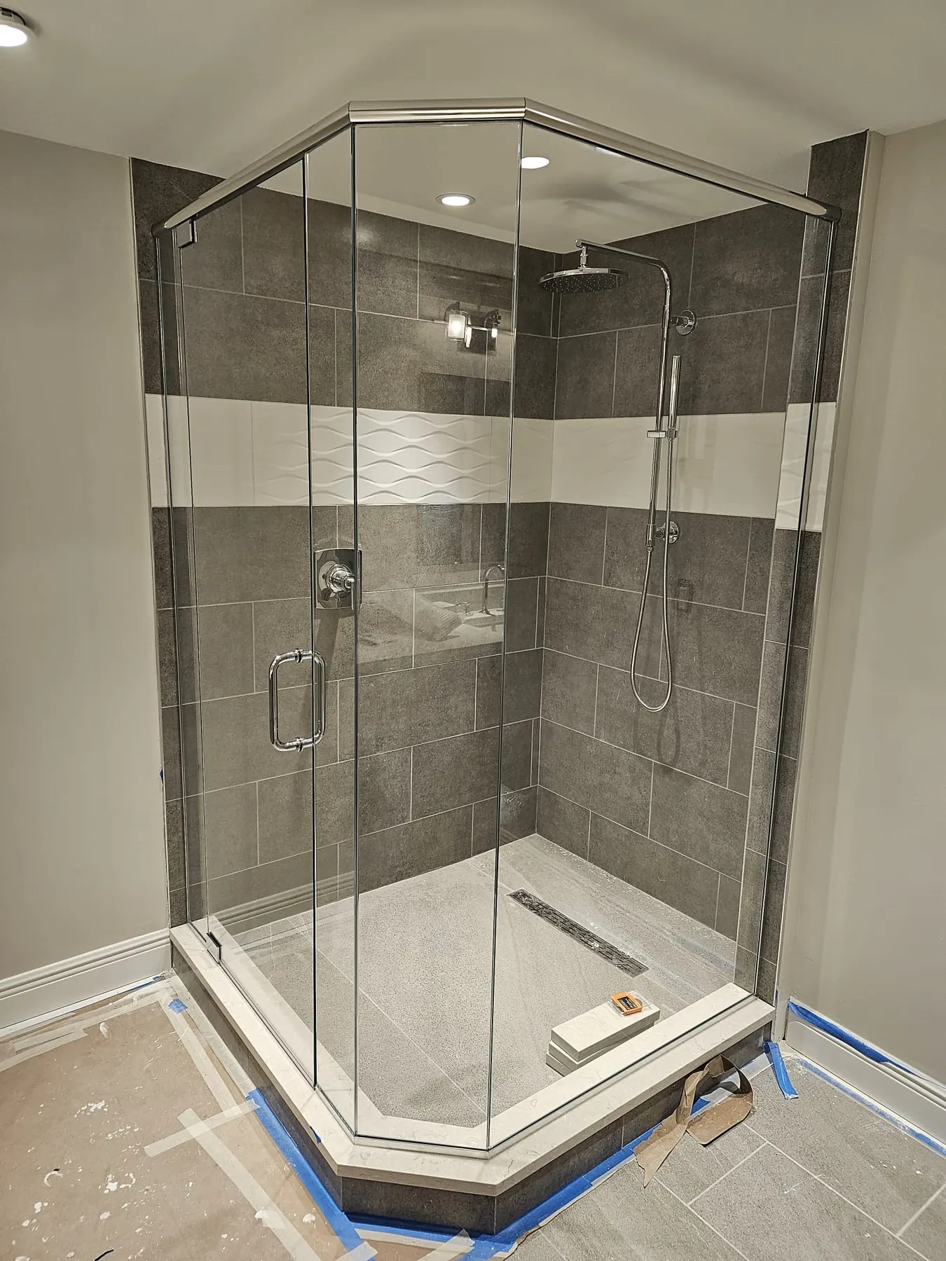 after frameless swing shower glass with chrome hardware in Southwest Florida