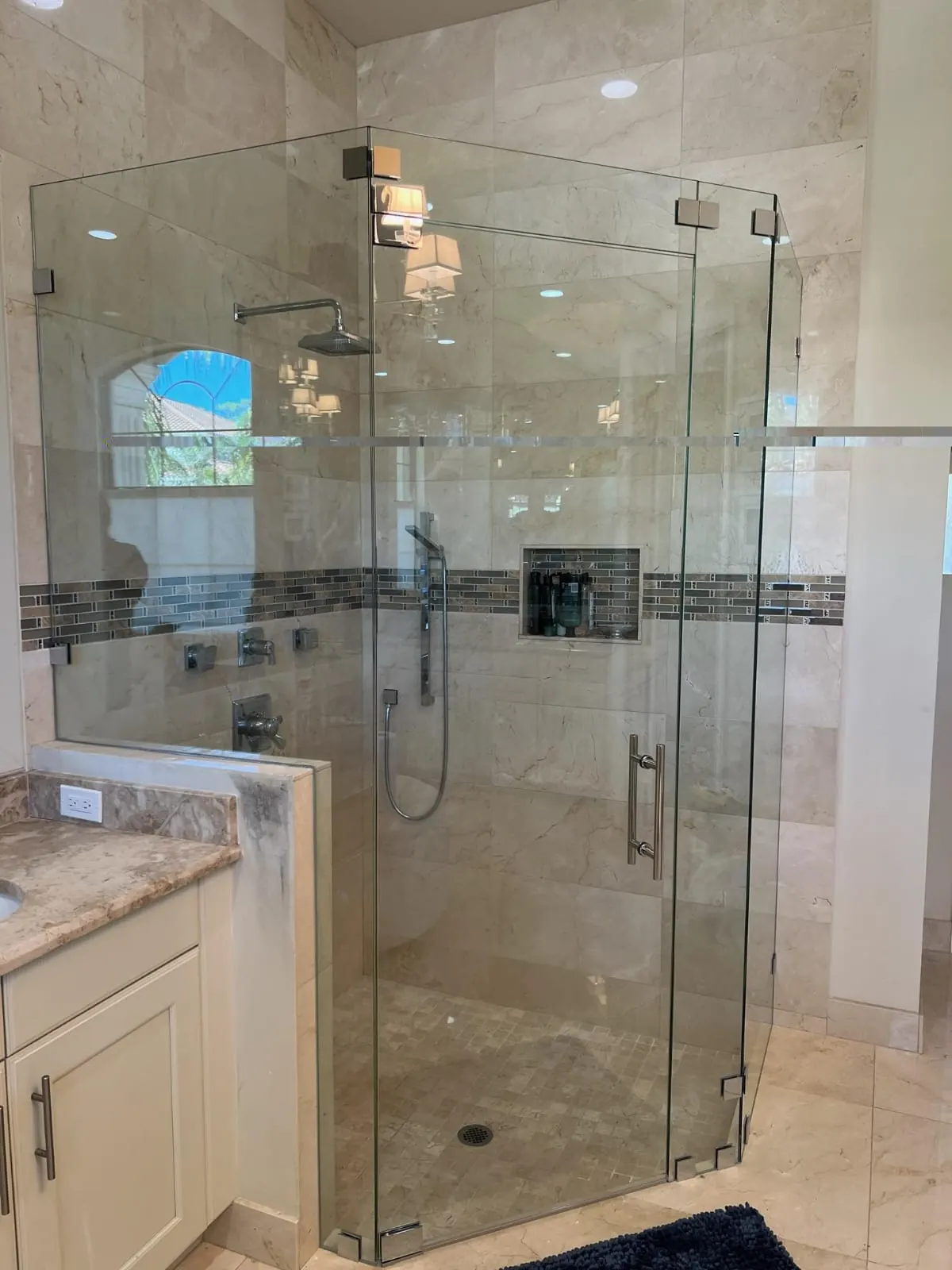 after frameless swing shower glass with chrome hardware in Southwest Florida