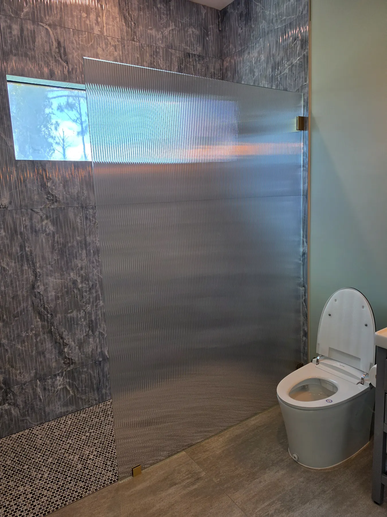 after frameless shower glass with brushed gold hardware in Southwest Florida serving Estero FL