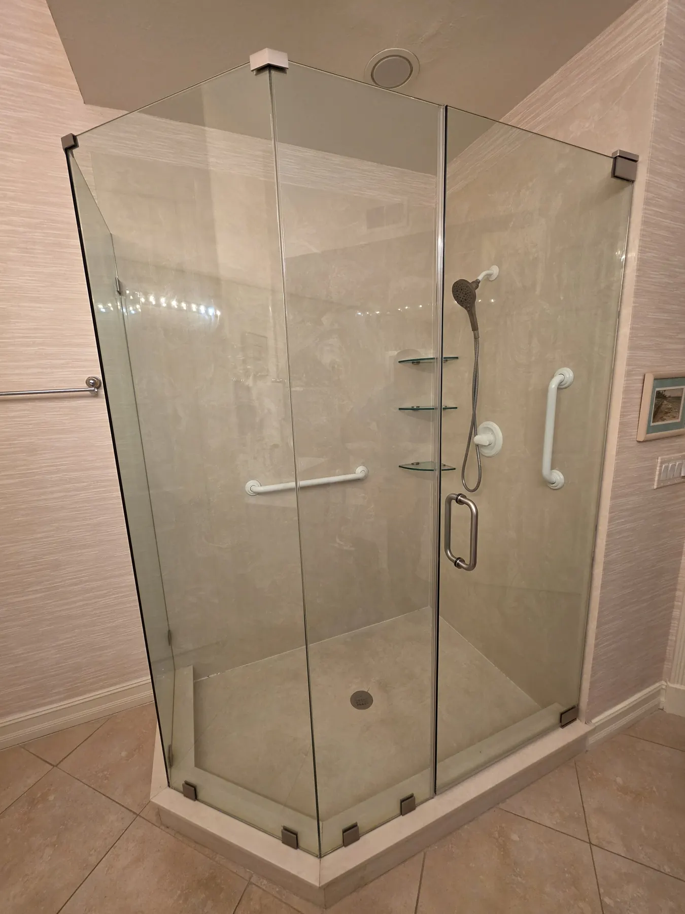 after frameless swing shower glass with brushed nickel hardware in Southwest Florida