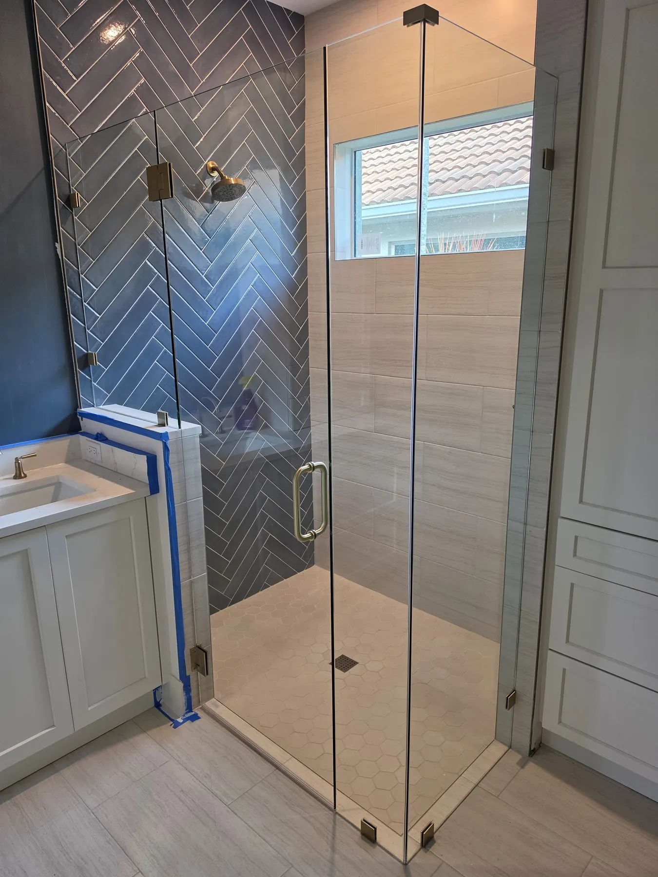 after frameless swing shower glass with brushed nickel hardware in Southwest Florida