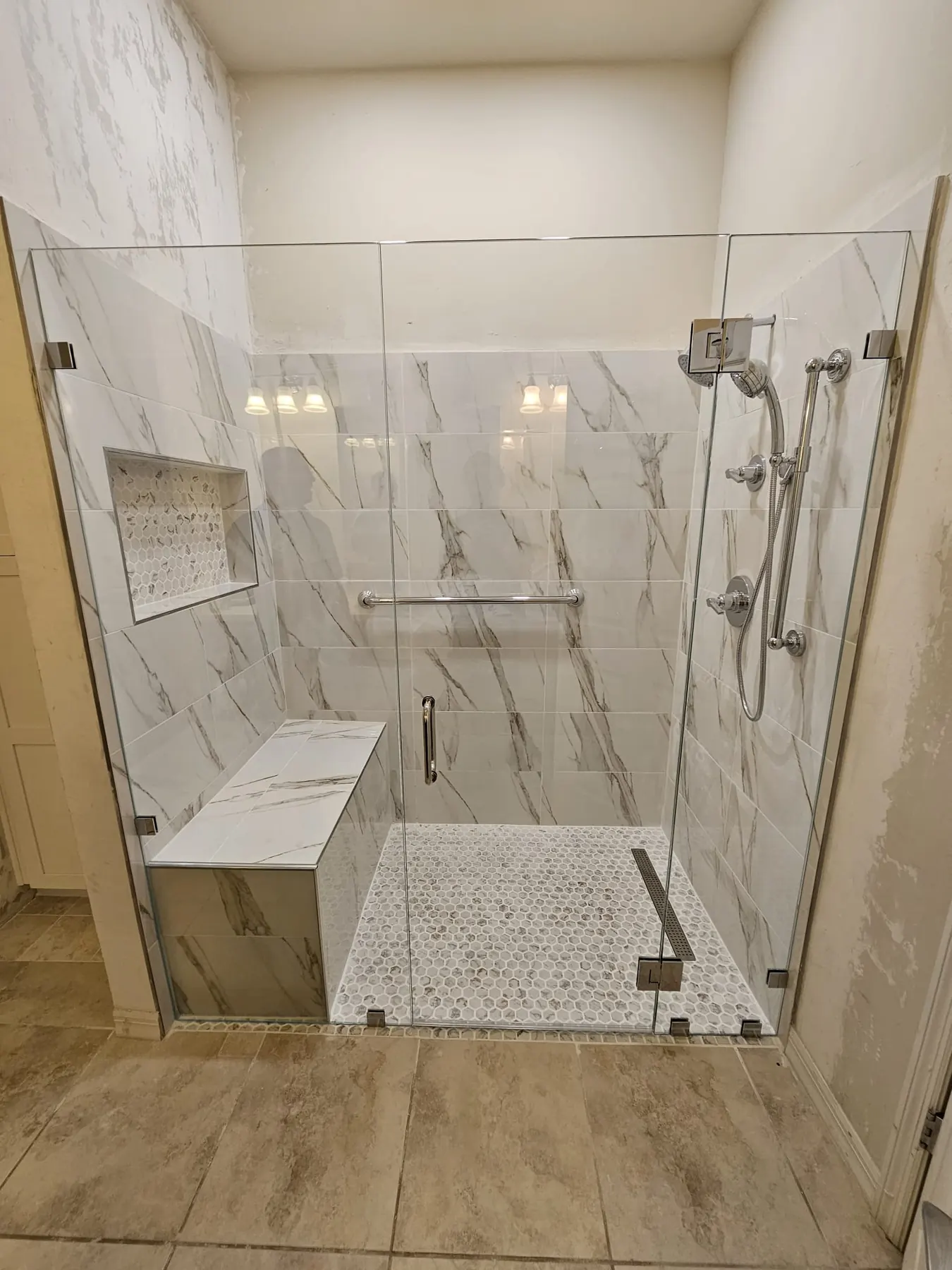 after custom swing shower glass with chrome hardware in Southwest Florida