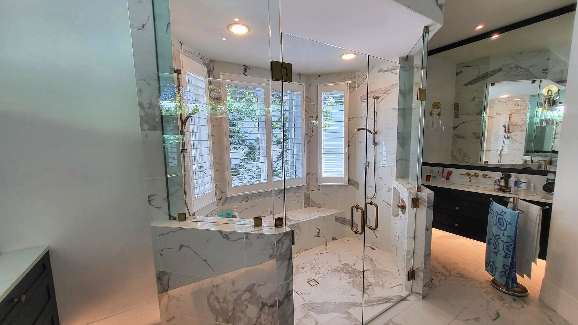 frameless shower glass enclosure installed in a Naples bathroom remodel