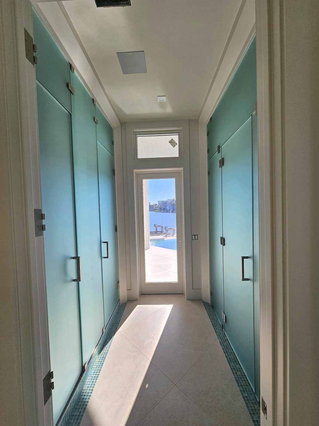 frosted interior glass doors installed in a Naples coastal home hallway